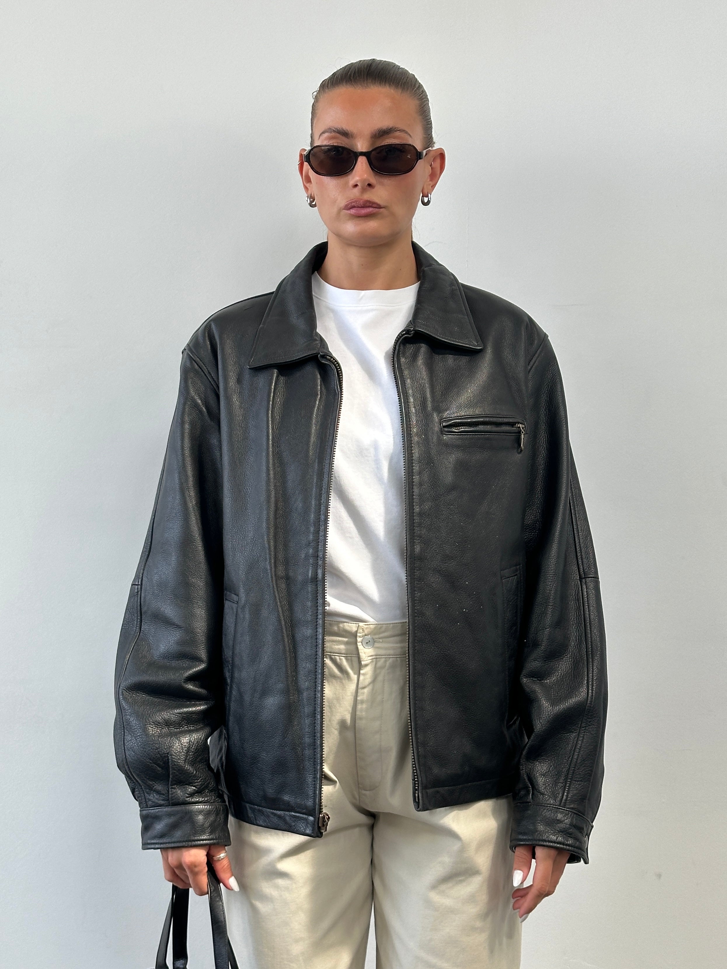 Vintage minimal leather jacket in size L, stylish men's jacket with a sleek, classic design and smooth leather texture.