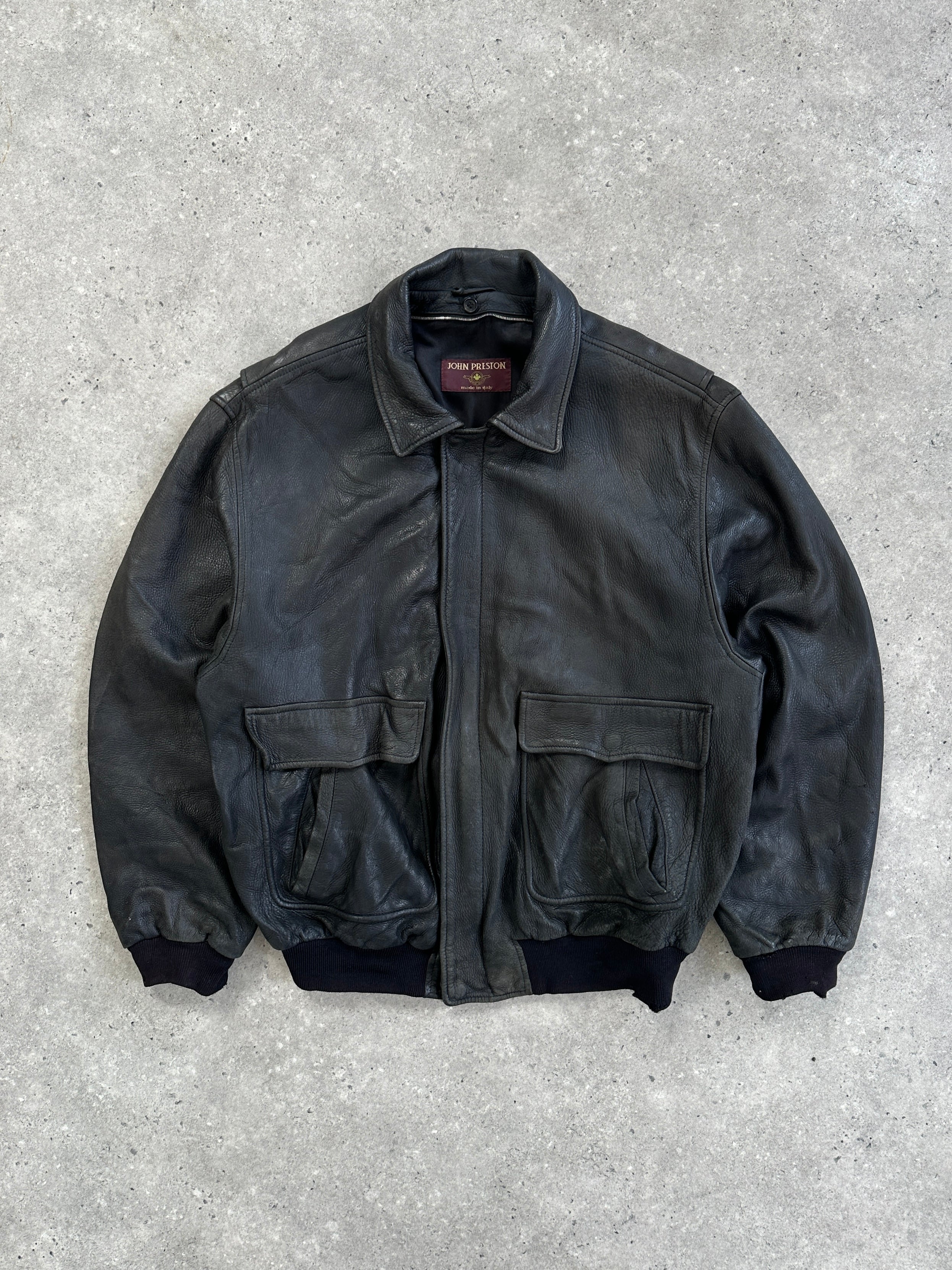 Vintage Italian aged leather bomber jacket in XL, featuring classic design and rich textured leather.