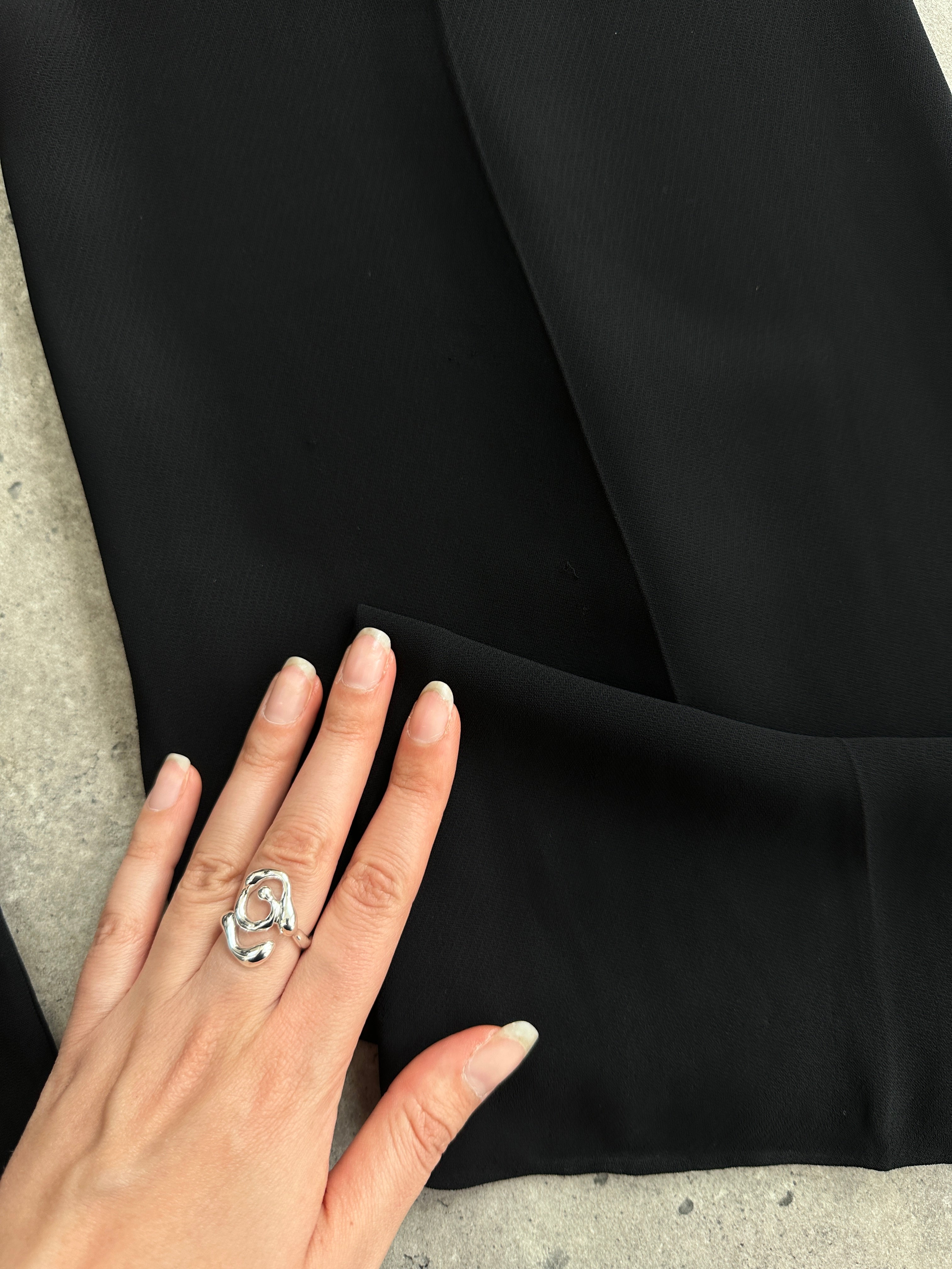 Valentino low waist wide-leg tuxedo trousers in black, showcasing tailored fit and sleek design with crisp creases.
