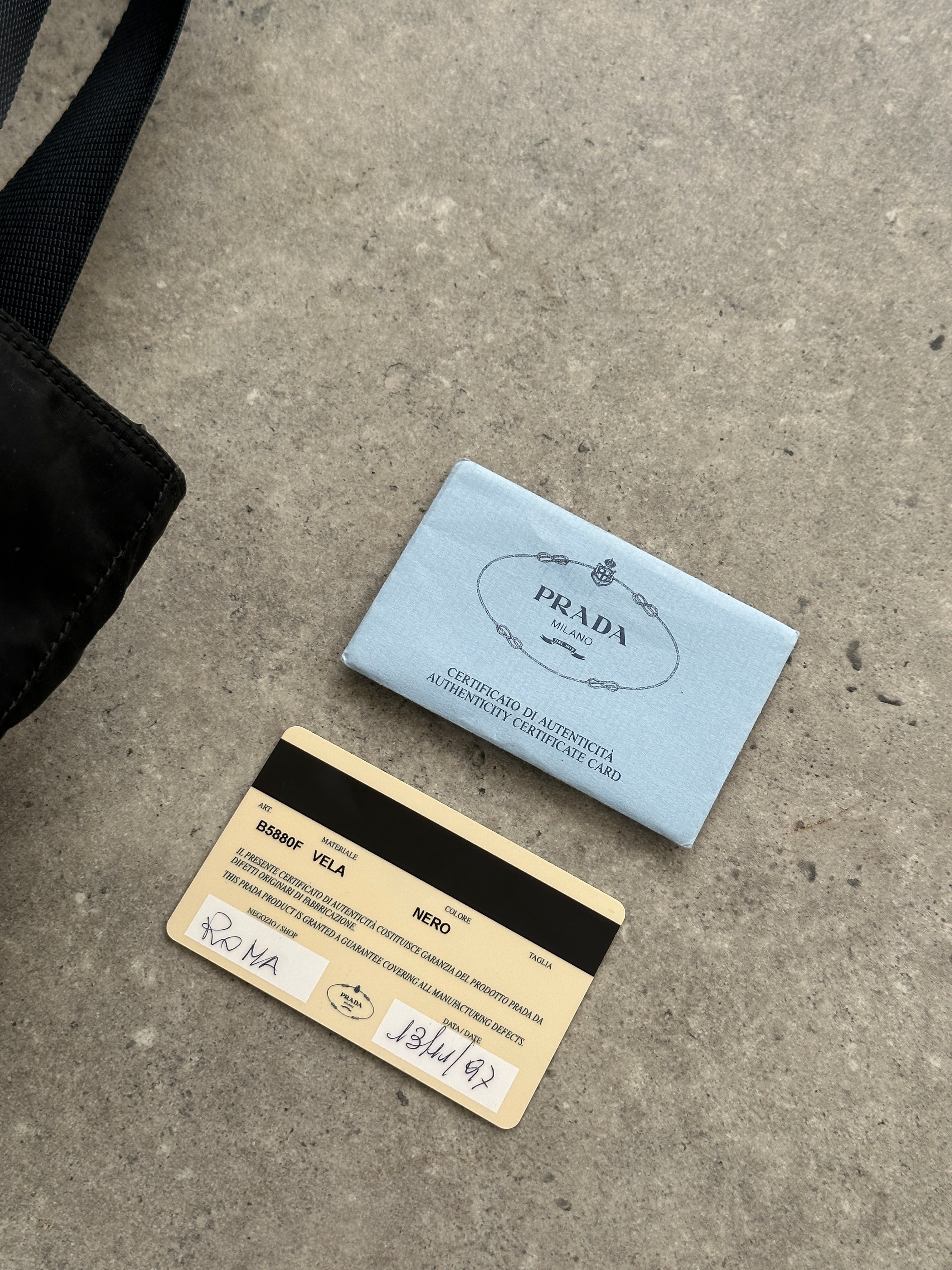 Prada 1997 nylon shoulder bag featuring a sleek design, adjustable strap, and Prada logo detail on durable nylon material.