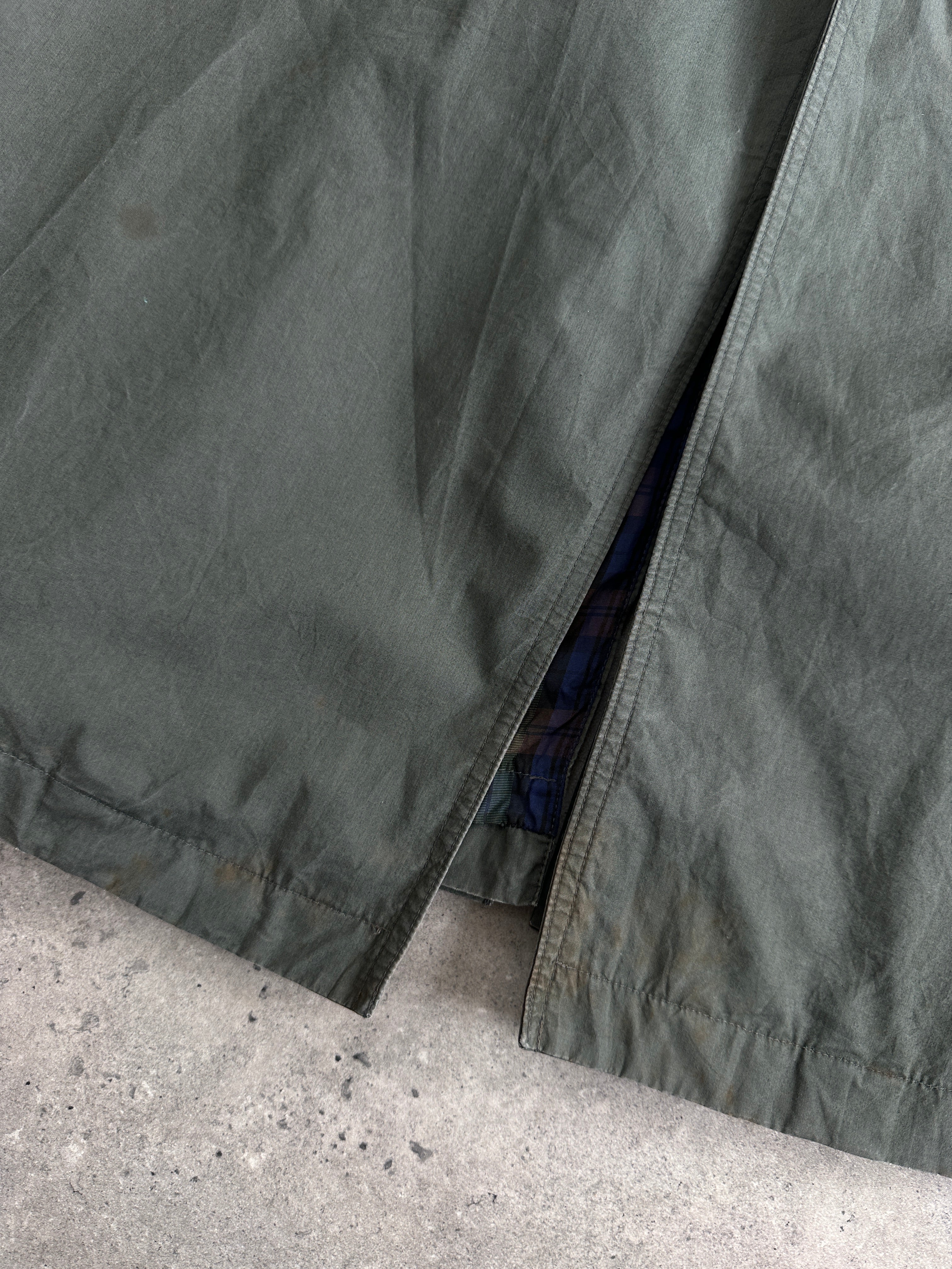 Yves Saint Laurent Diffusion Hommes pure cotton trench coat with concealed placket, in size large, displayed on a hanger.