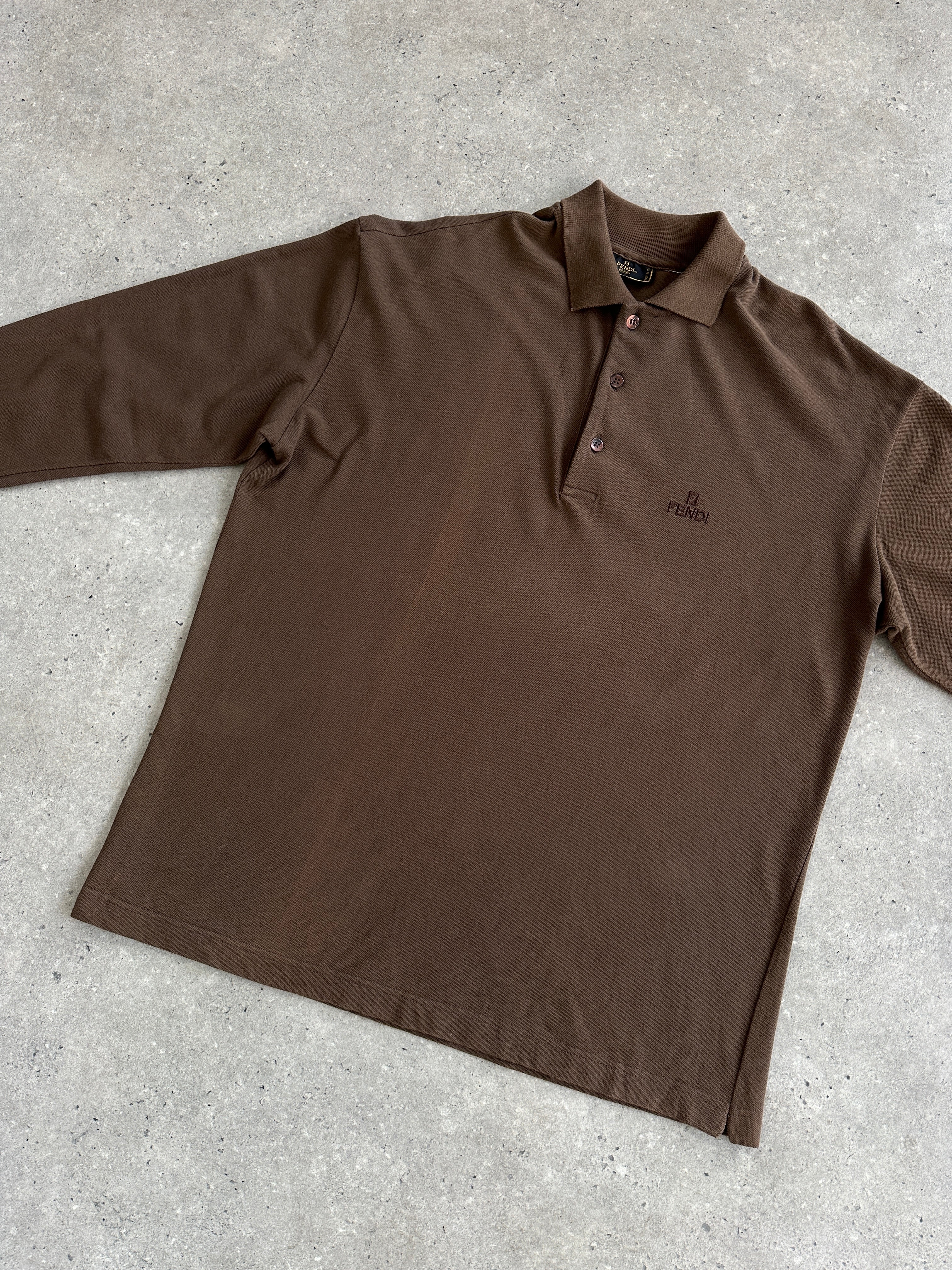 Fendi cotton logo polo jumper in size L/XL, featuring the signature Fendi logo and classic polo collar on a white background.