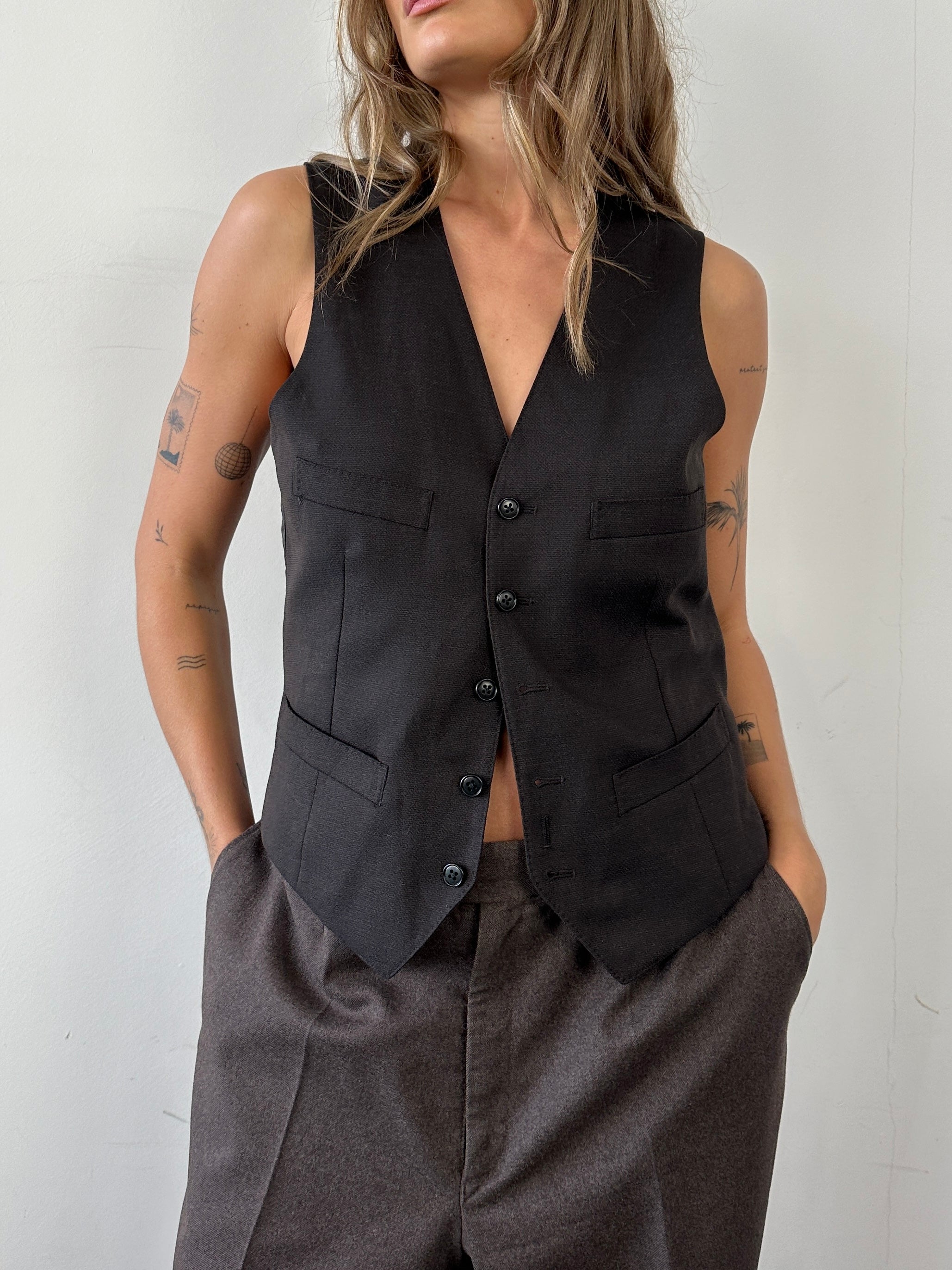 Vintage wool waistcoat coat in size M, featuring classic design and tailored fit, ideal for vintage fashion enthusiasts.
