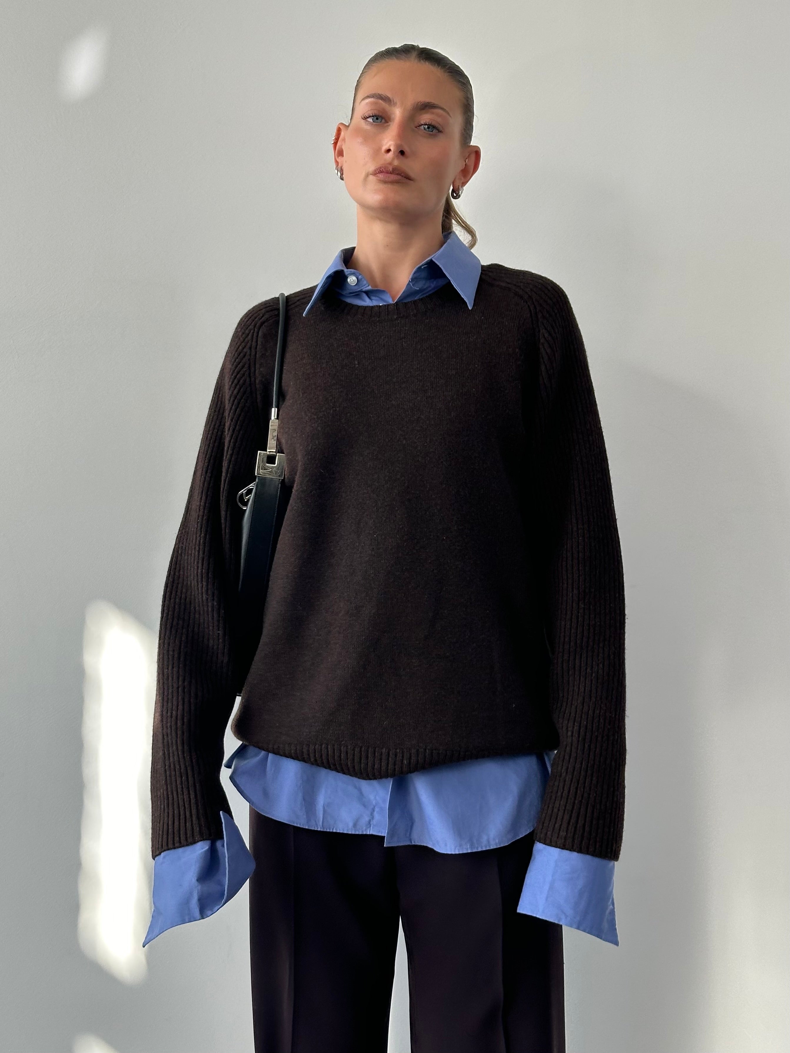 Jaeger pure merino wool jumper in size L/XL, navy blue, with a classic crew neck and soft knit texture.