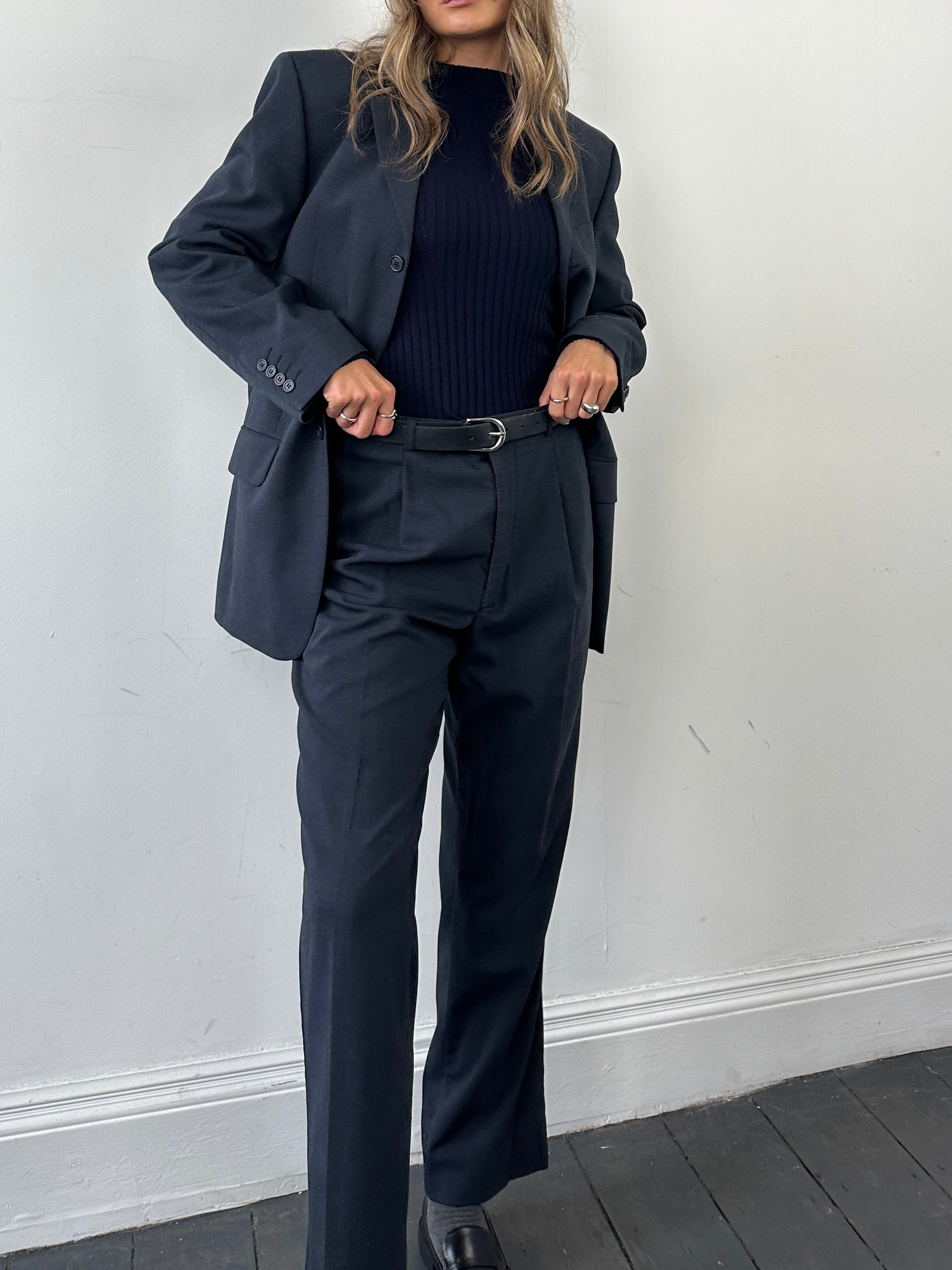 Vintage wool single-breasted suit jumpsuit in size 38R/W30, showing the tailored fit and classic design with lapel collar.