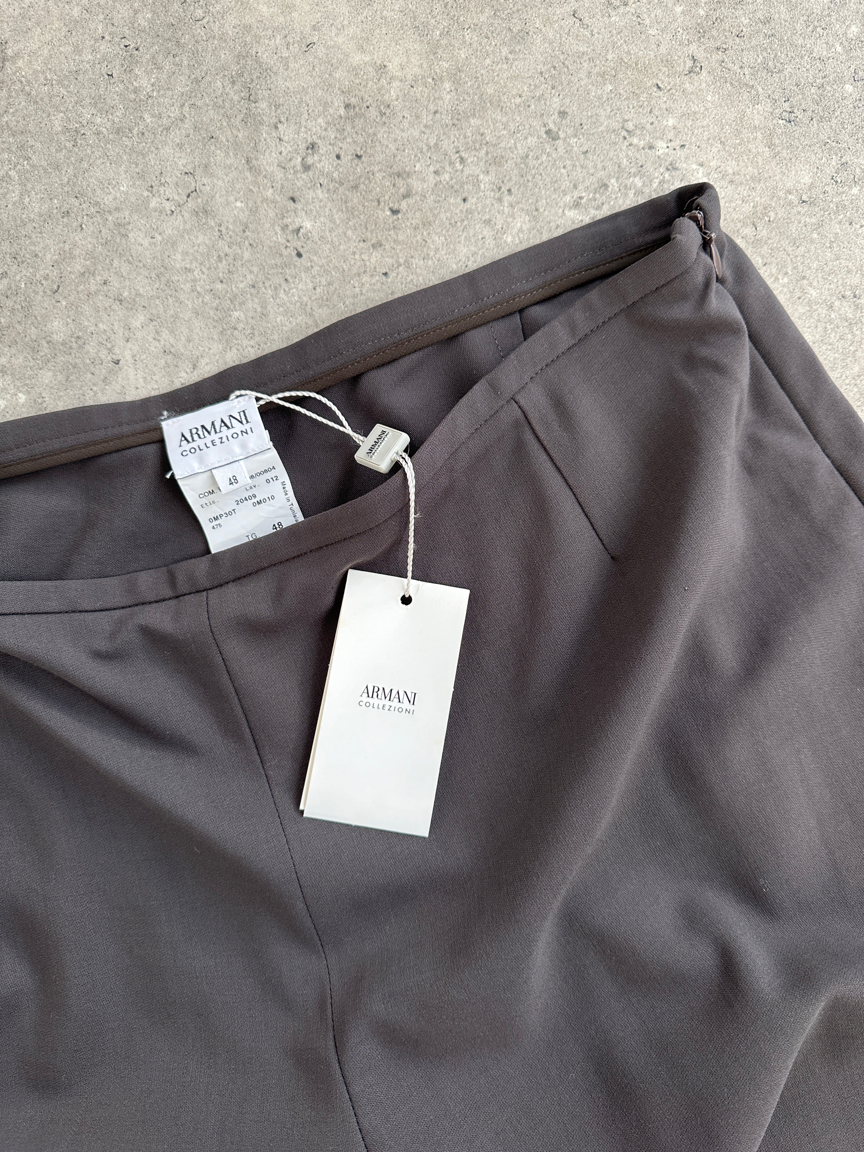 Armani Collezioni pure wool wide-leg tailored trousers in beige, front view showing high waist and relaxed fit.