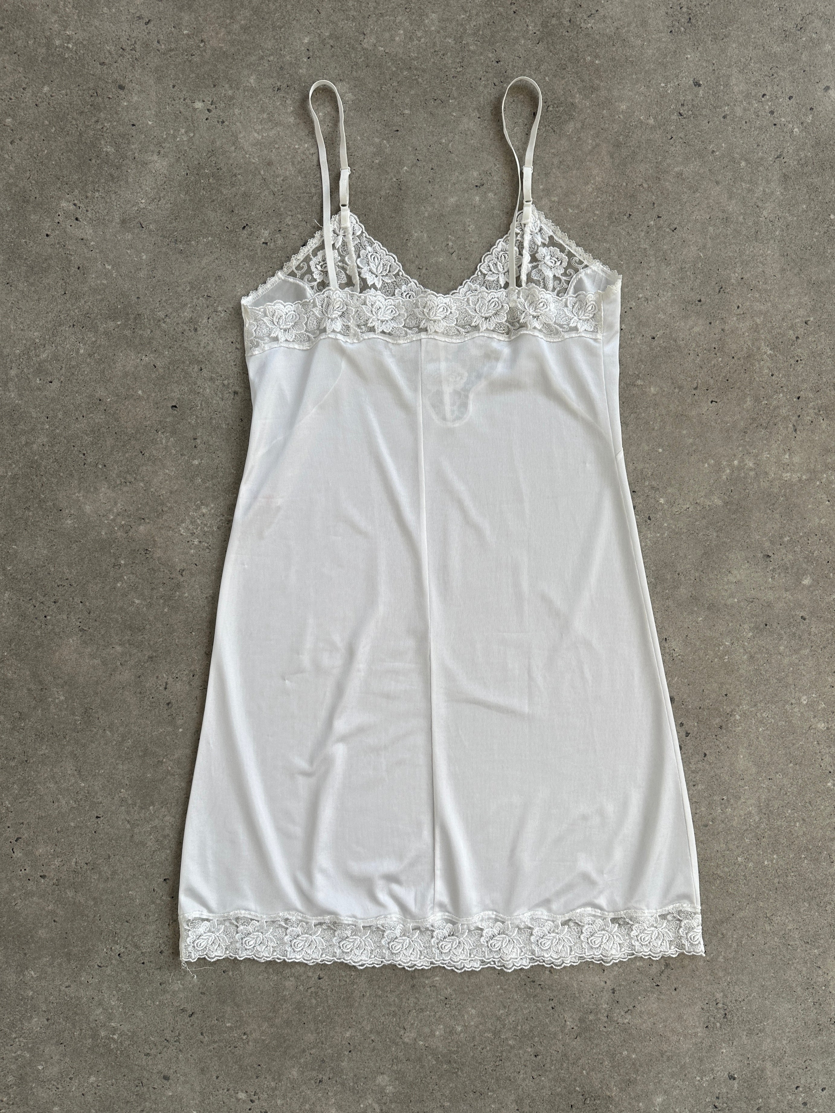 Vintage 1990s lace sheer mini slip dress in size S with delicate lace details and a vintage-inspired design.