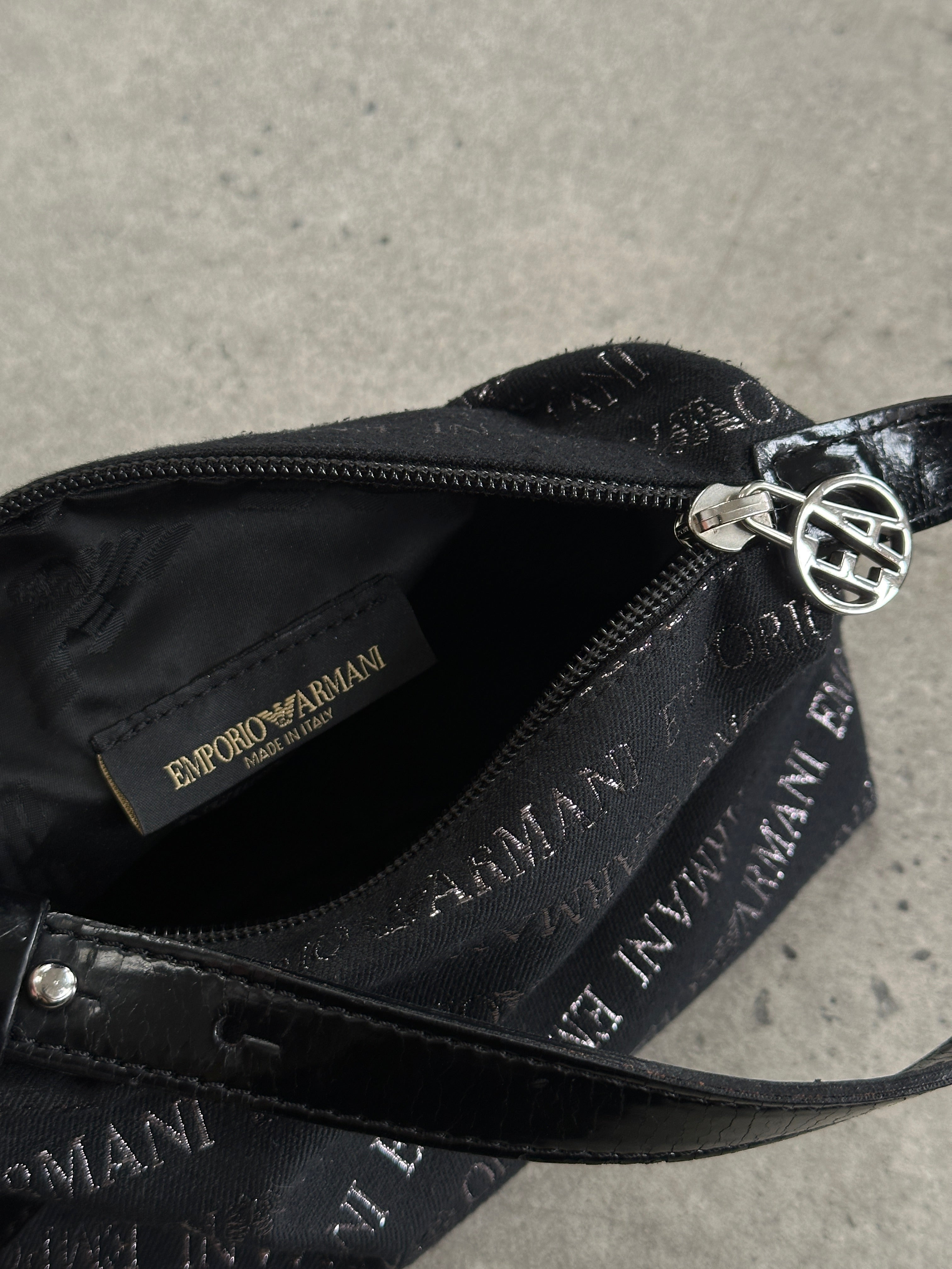 Emporio Armani Monogram Shoulder Bag with adjustable strap, featuring signature Armani monogram pattern and sleek design.