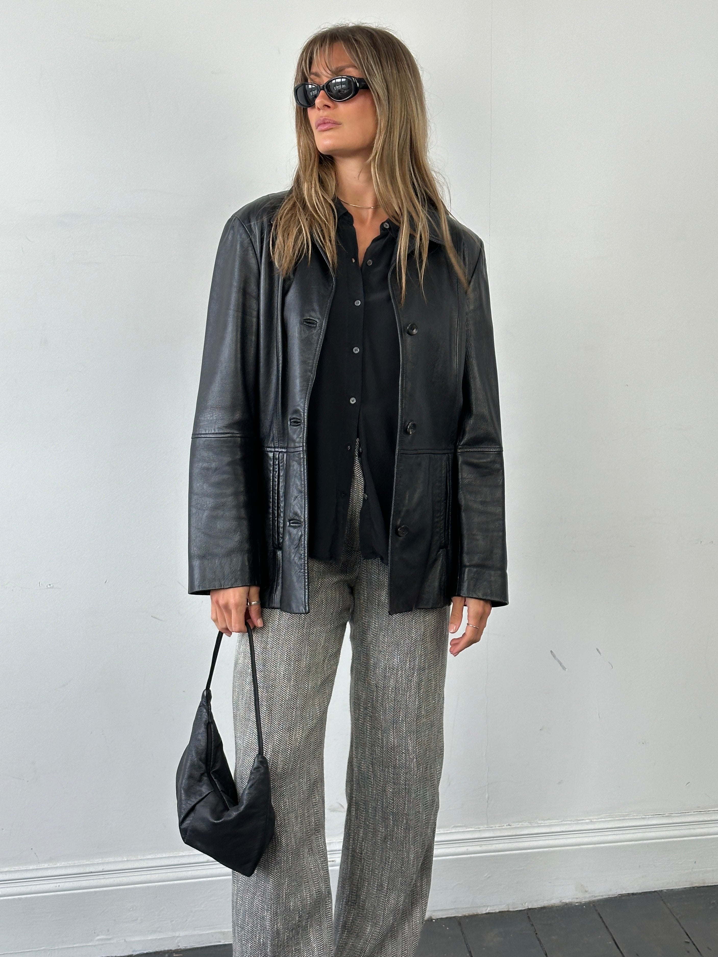 Marella smooth leather jacket in size M, featuring a sleek design with a classic collar and fitted silhouette.