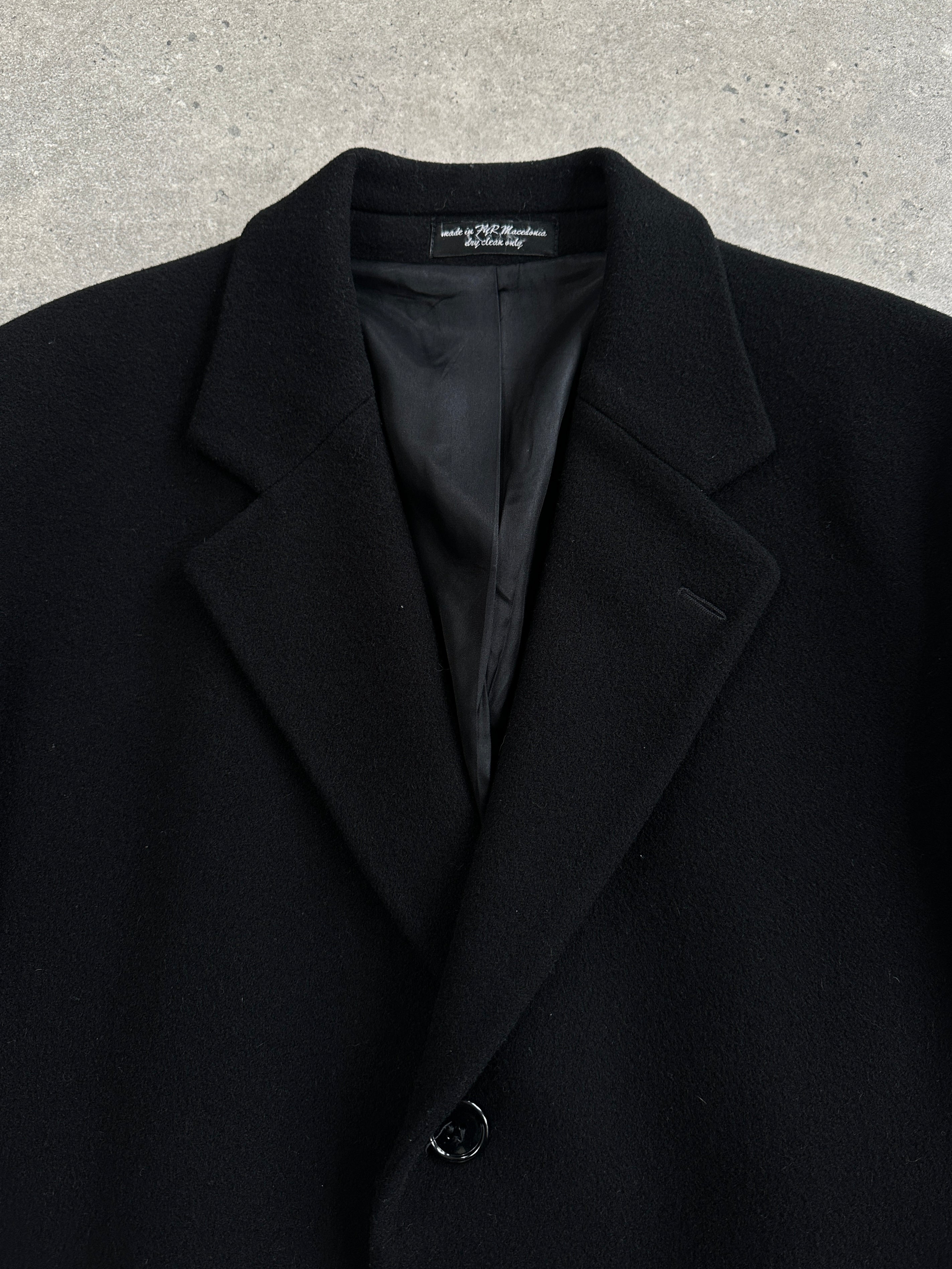 Vintage 1990s wool single-breasted coat in size XL, classic style with button closures and a timeless design.
