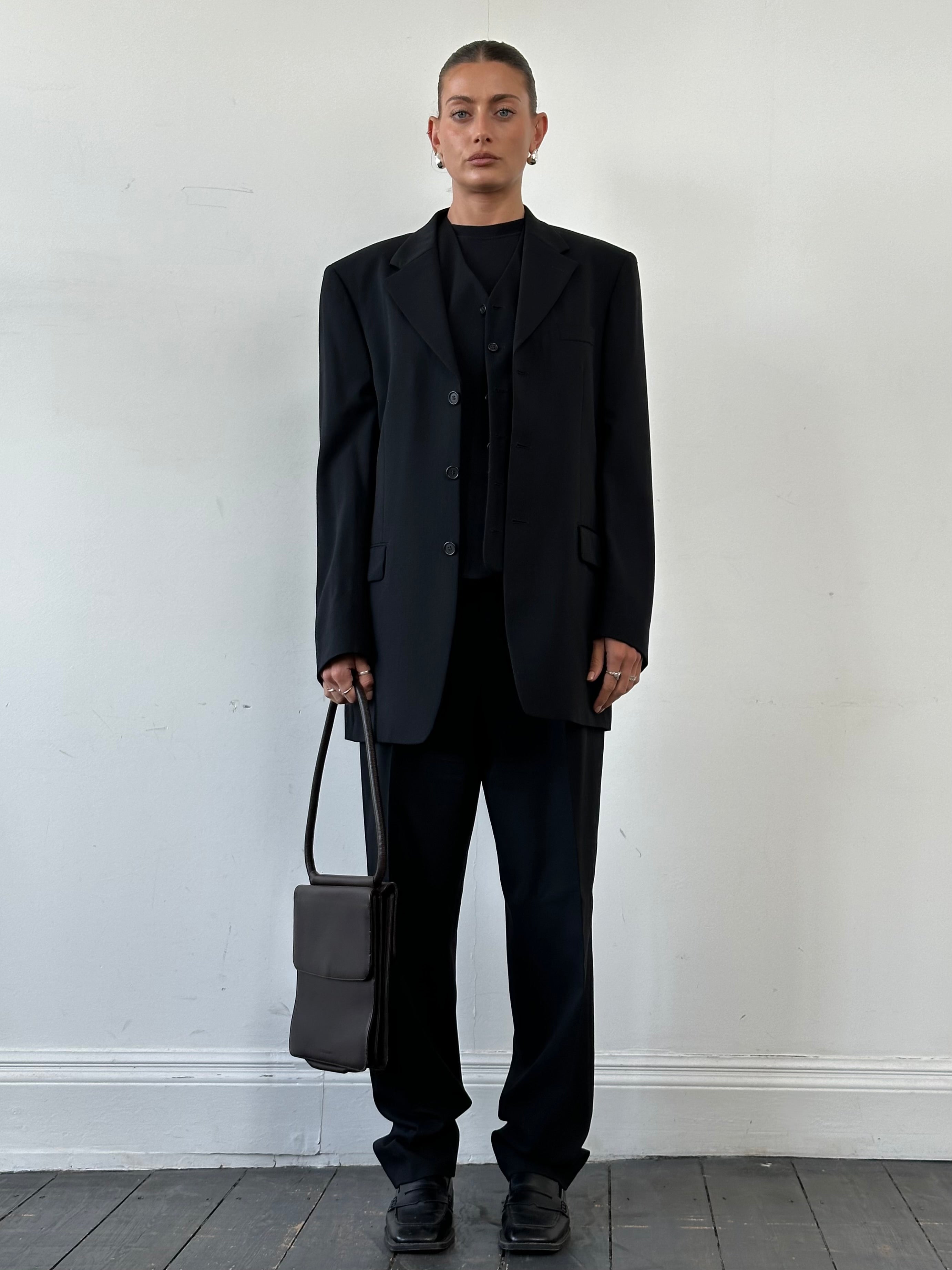 Yves Saint Laurent Pour Homme pure wool three-piece suit in size 40L/W32, tailored fit, dark navy color, with jacket, vest, and trousers.