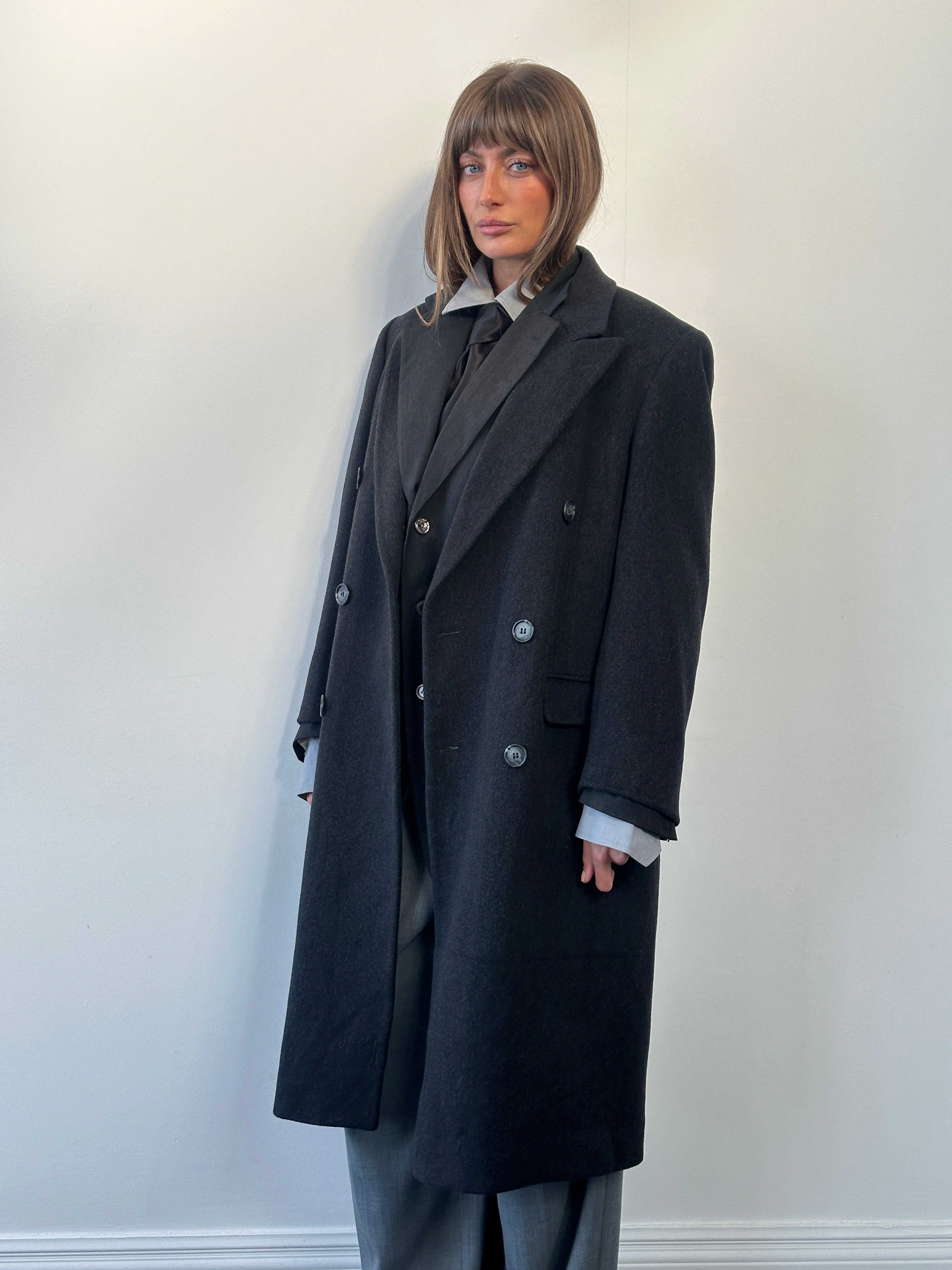 Vintage 1980s pure wool double-breasted coat in size large, featuring classic style and timeless design.