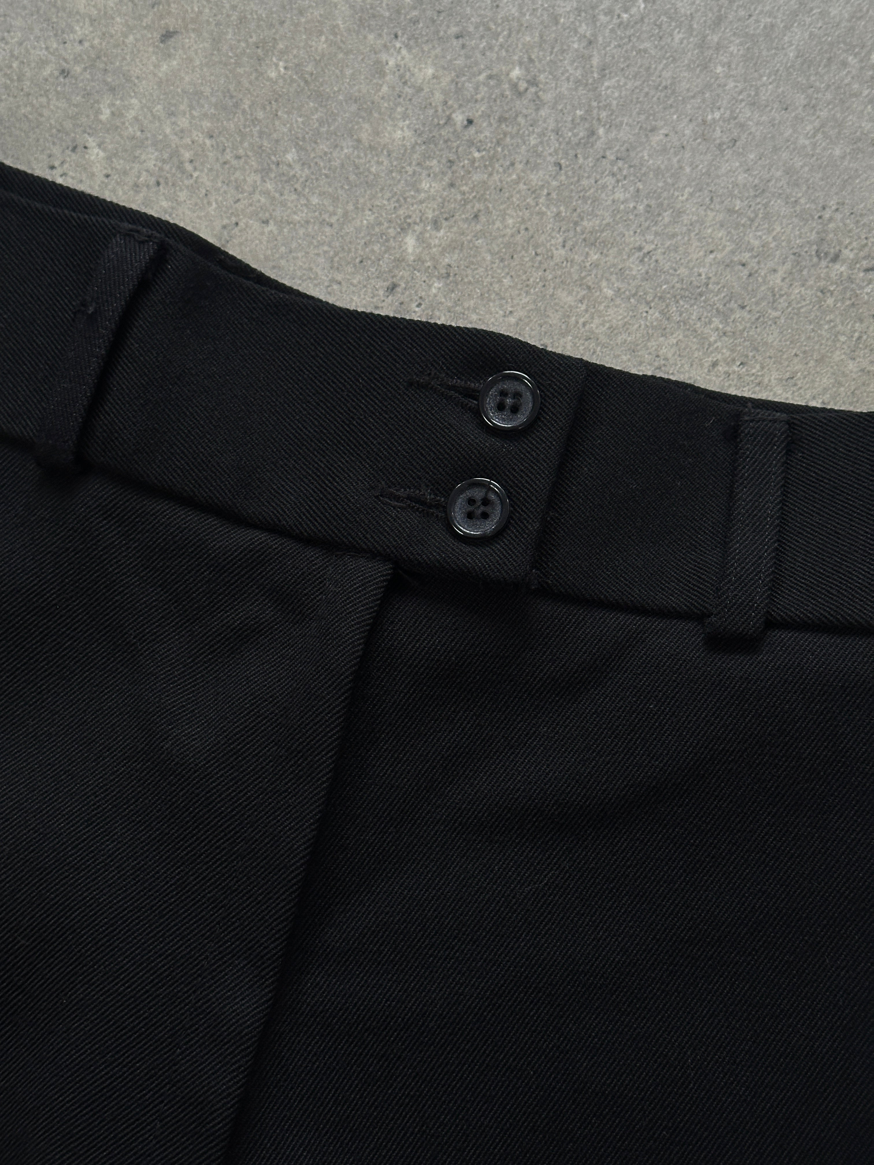 Vintage 1990s pure wool tailored wide-leg trousers in size W26, showcasing classic beige fabric and high-waisted fit.
