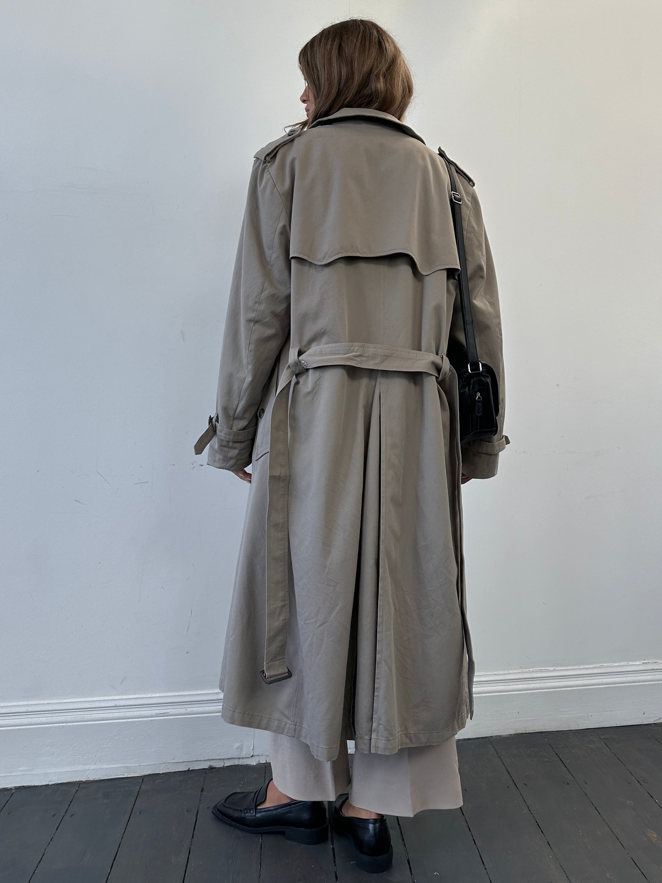 Christian Dior double-breasted cotton trench coat in size L/XL, featuring classic design and stylish tailoring.