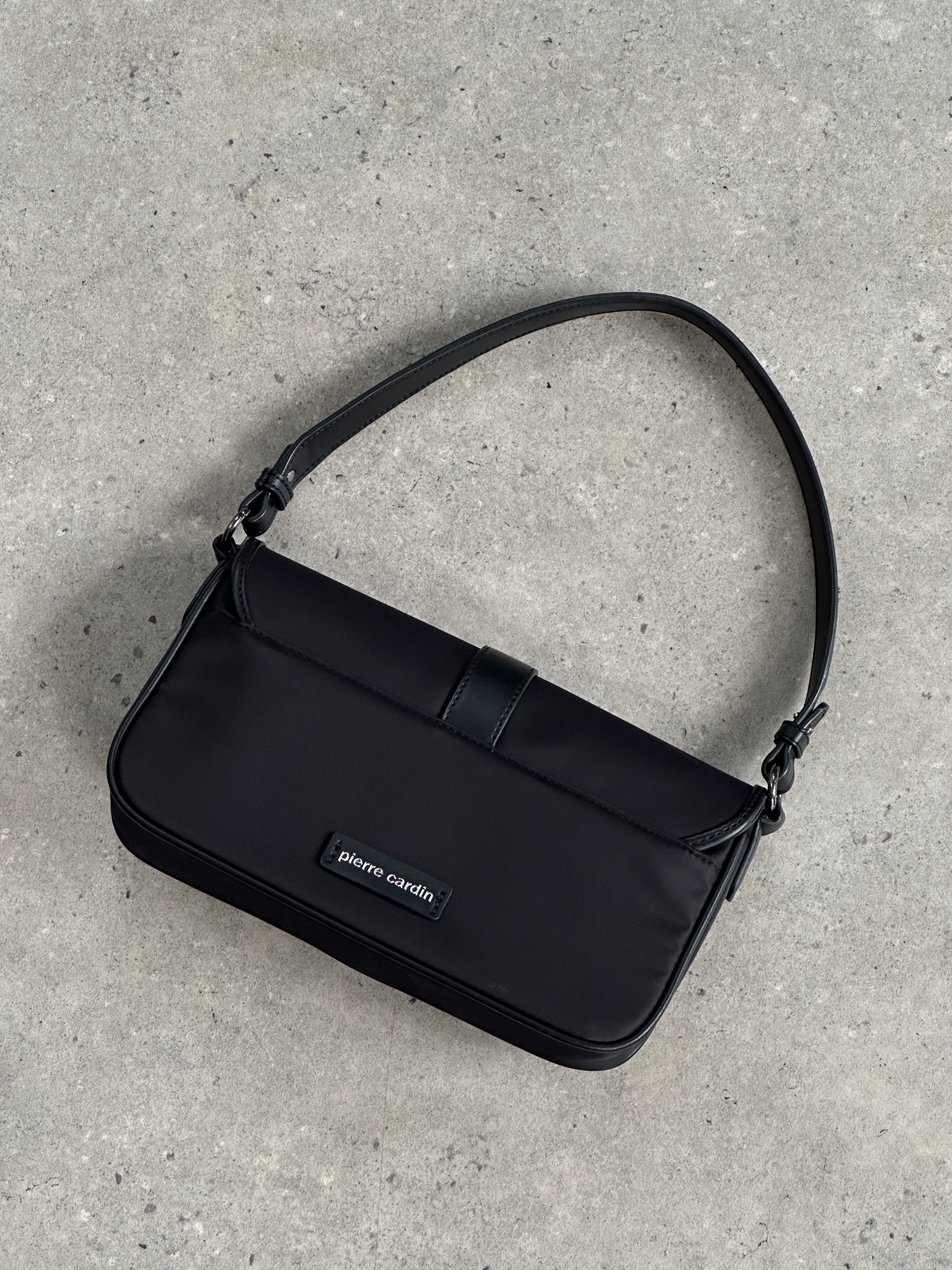 Pierre Cardin nylon hardware shoulder bag with adjustable strap and sleek design, ideal for stylish everyday use.