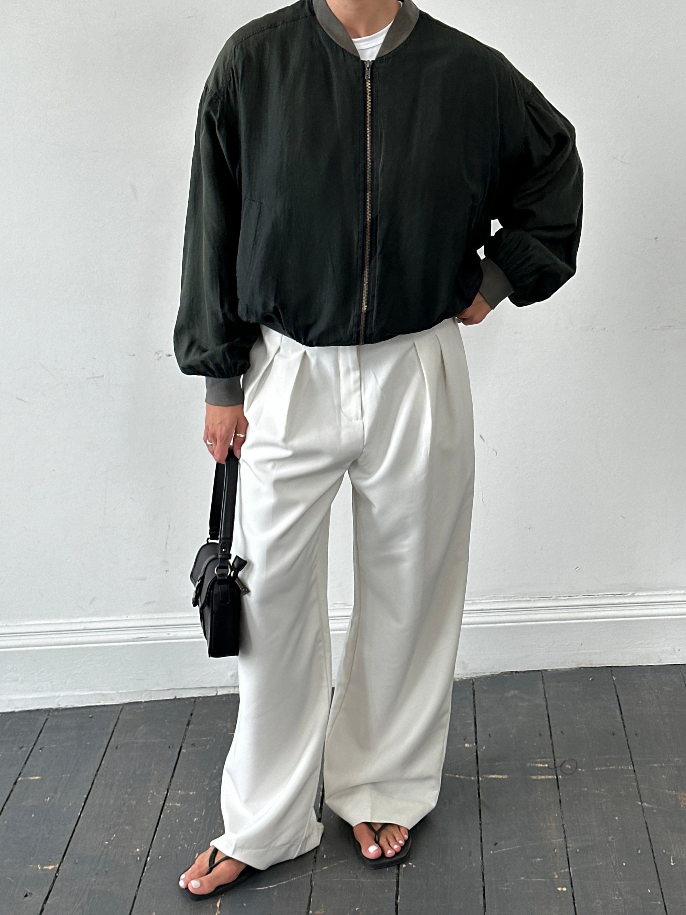 Vintage pure silk bomber jacket in size L with a classic design, featuring smooth fabric and a sleek, timeless style.