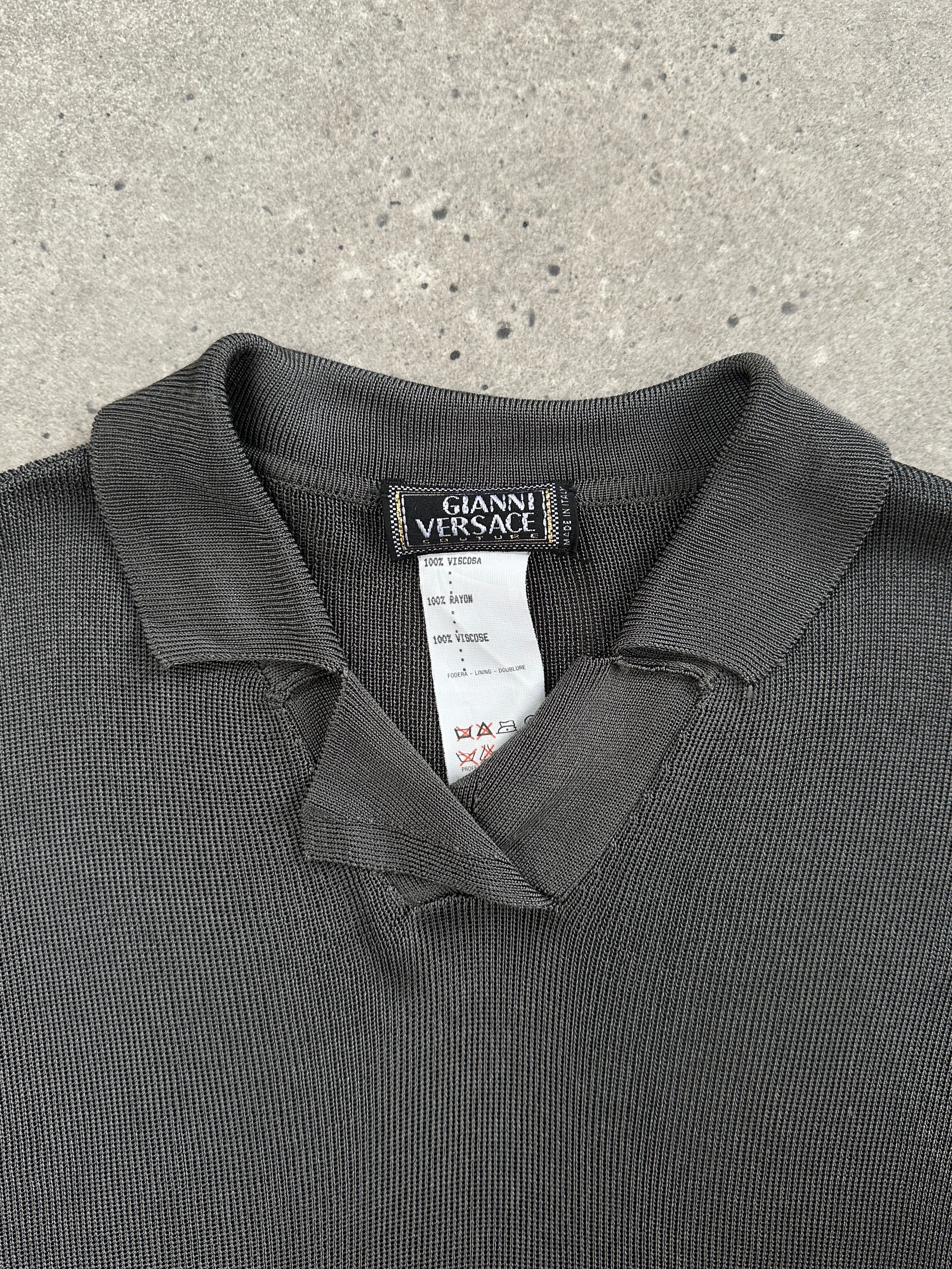 Gianni Versace Couture 1990s polo top in size M featuring bold designer logo and classic polo style, vibrant colors and luxurious fabric