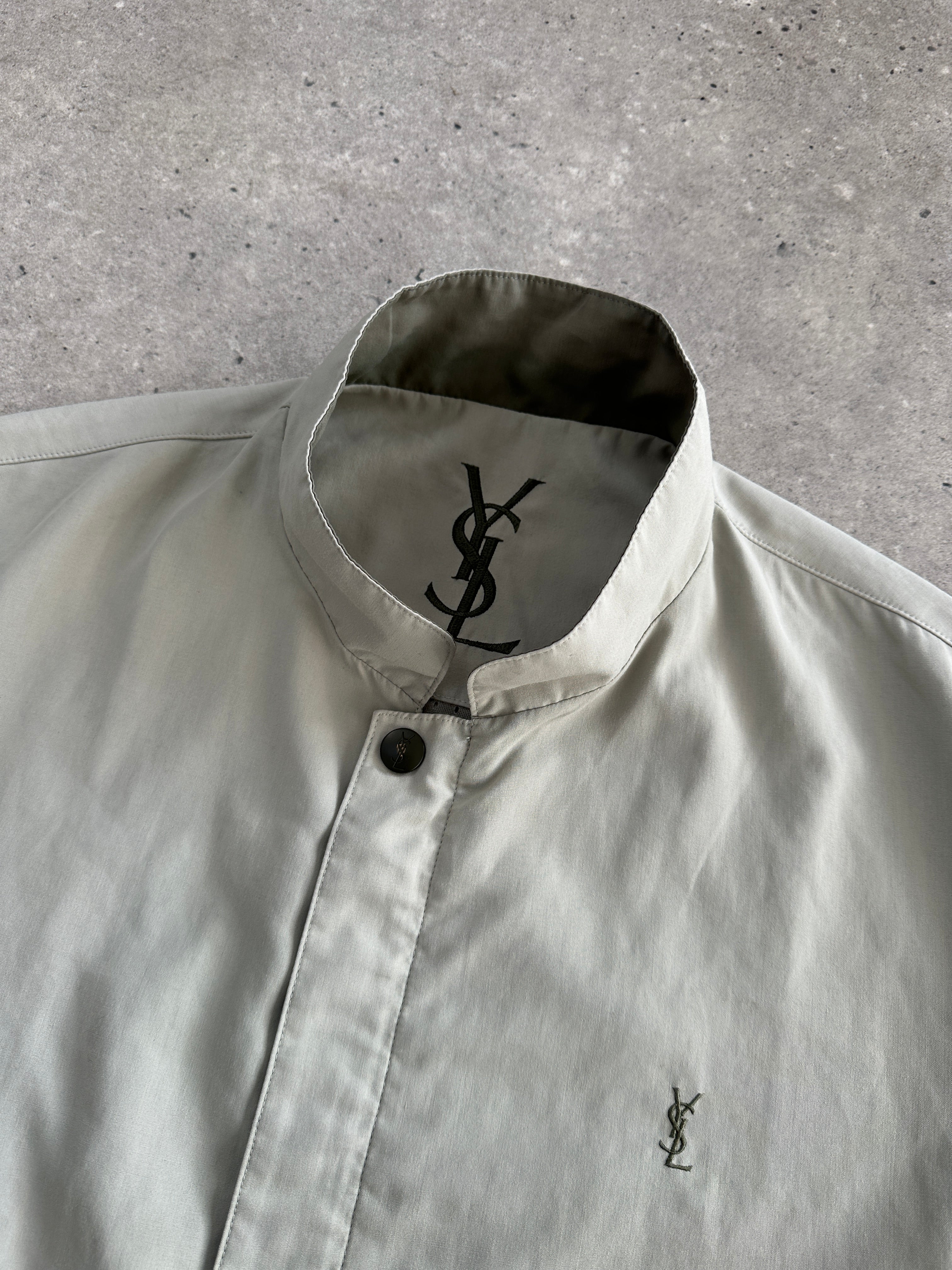 Yves Saint Laurent Pour Homme logo bomber jacket in size L, black with signature branding and zip-front design.