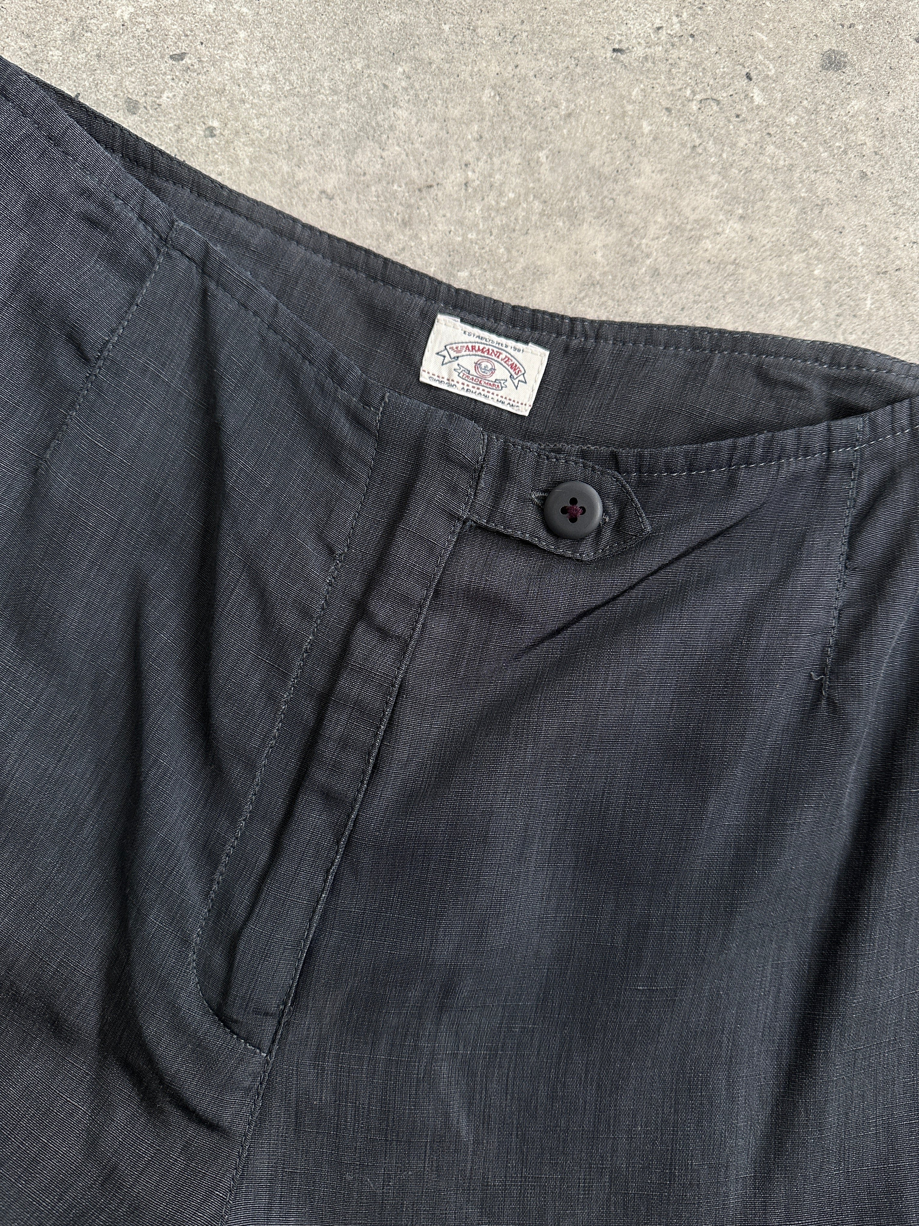 Armani Jeans linen straight-leg mid-waist trousers in size W28, shown in a neutral color, with belt loops and classic fit.