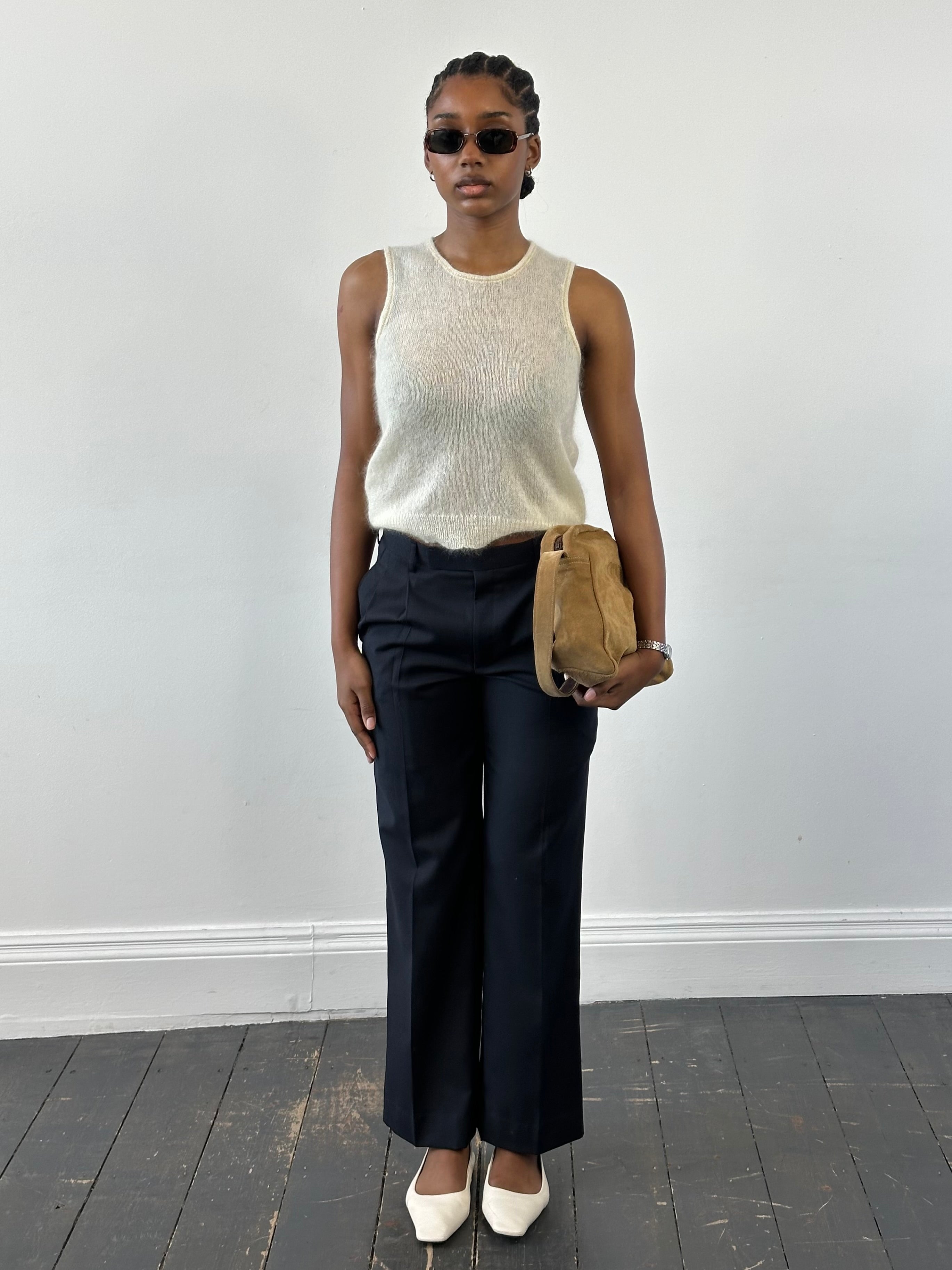 Vintage 2000s wool tailored trousers with pleats and straight legs, size W28, showcasing classic vintage style.