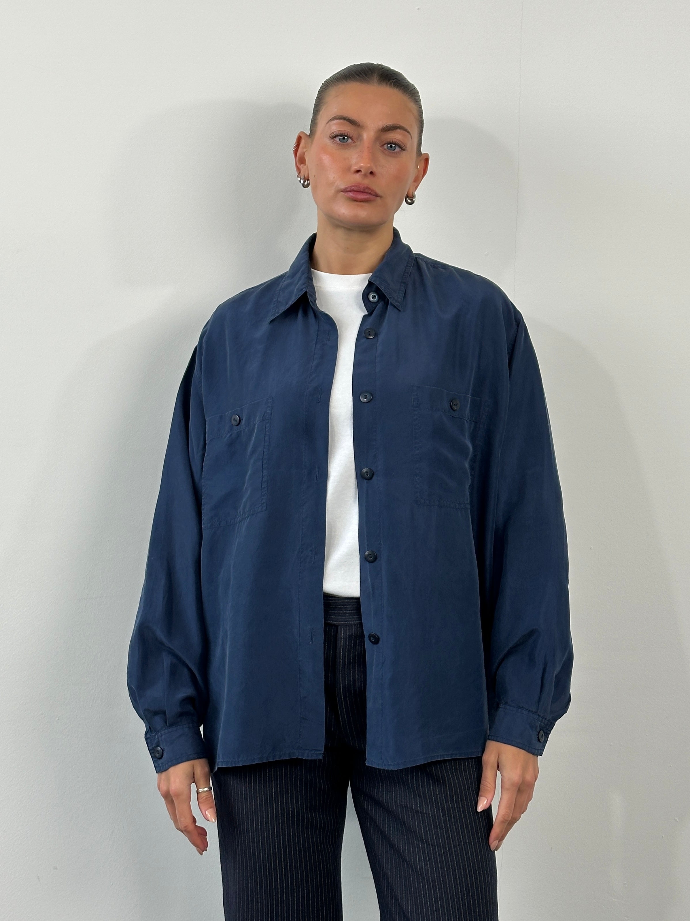 Vintage 1990s pure silk shirt, size large, featuring a classic design with smooth fabric and elegant craftsmanship.