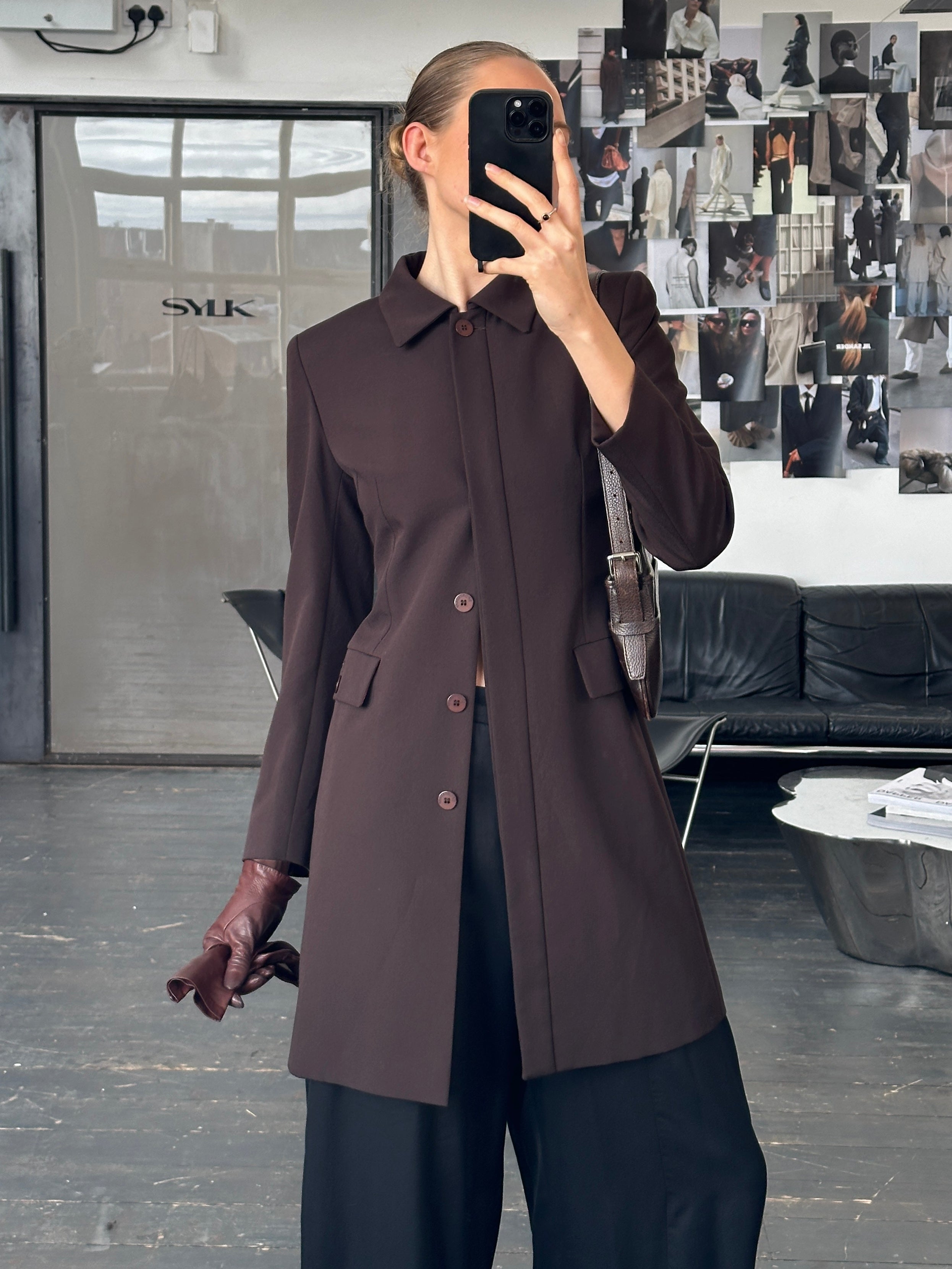 Vintage Italian 1990s minimal tailored coat in XS/S, showcasing sleek design and classic style with tailored fit and vintage fabric.