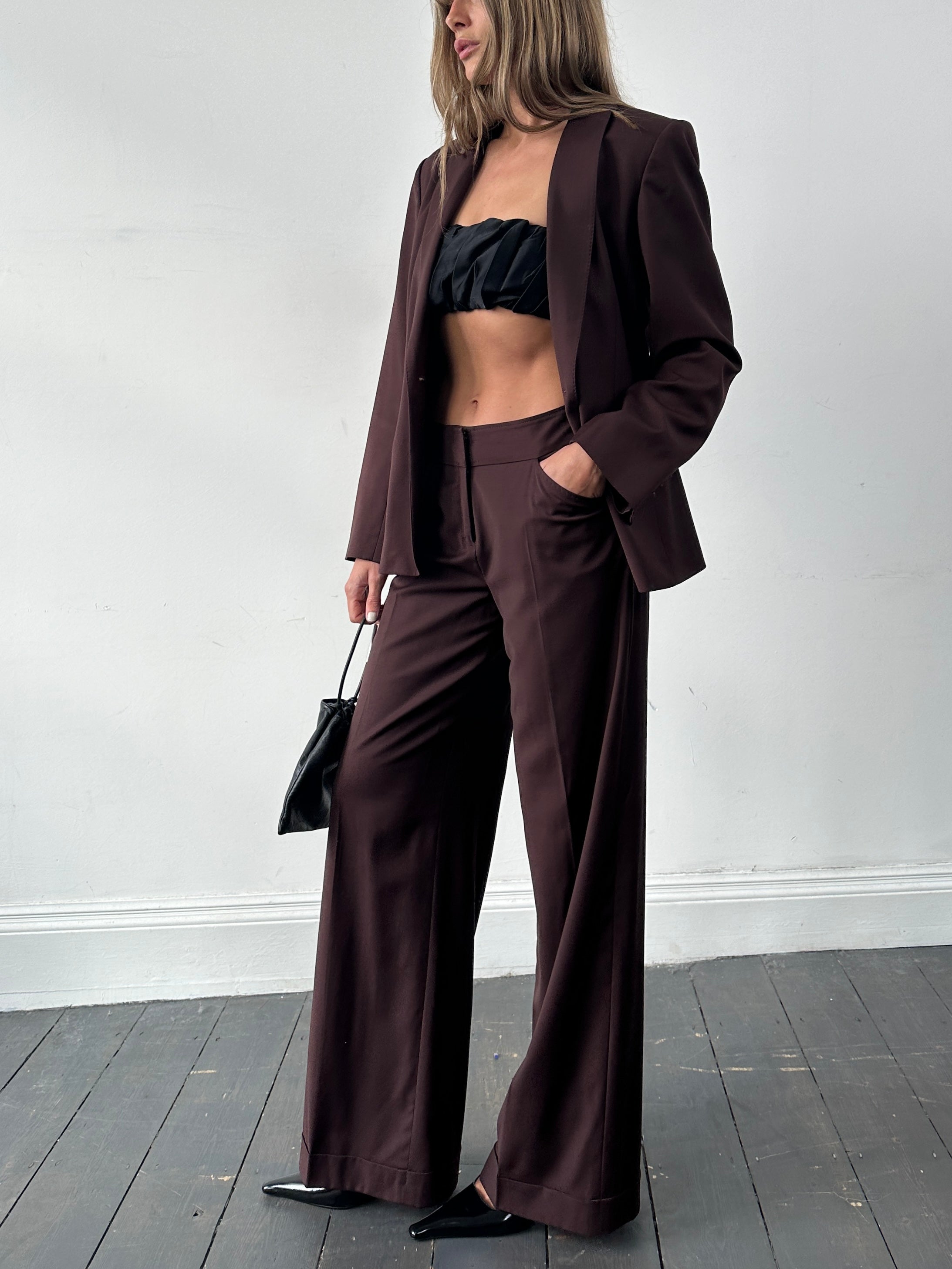 Max Studio wool jumpsuit featuring wide-leg design, single-breasted suit with a tailored fit, in a sleek, professional style.