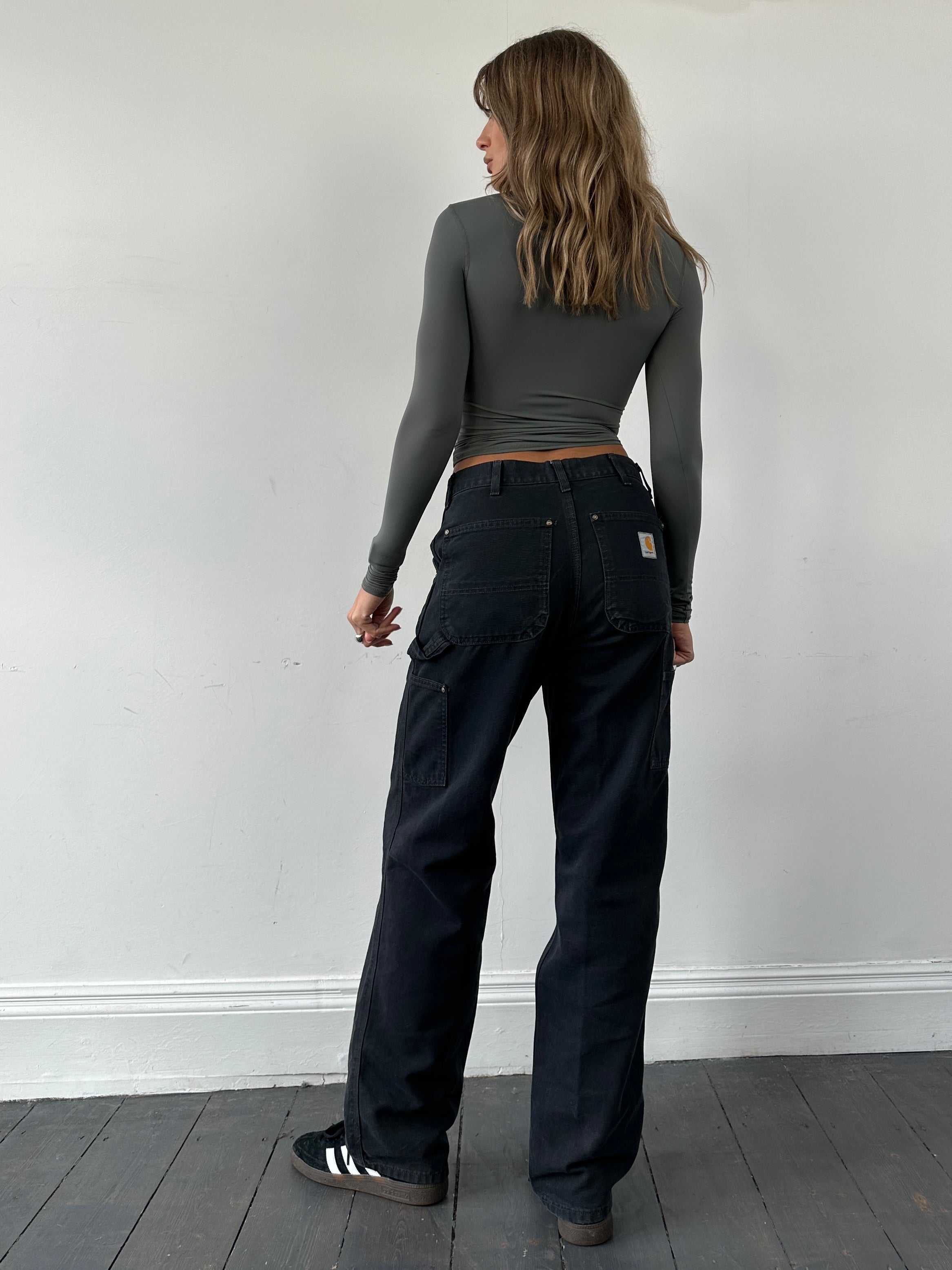 Carhartt high waisted cargo denim jeans with multiple pockets and classic blue wash, size W30, front view showing fit and style.