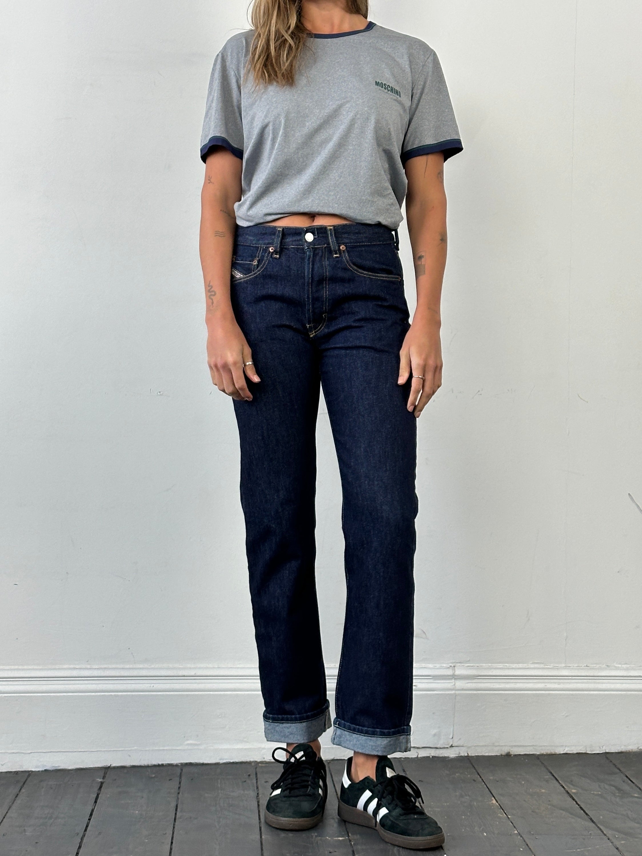 Diesel 575 Cochise 90s straight leg denim jeans in W28, showing classic blue denim with a fitted waistband and straight cut.