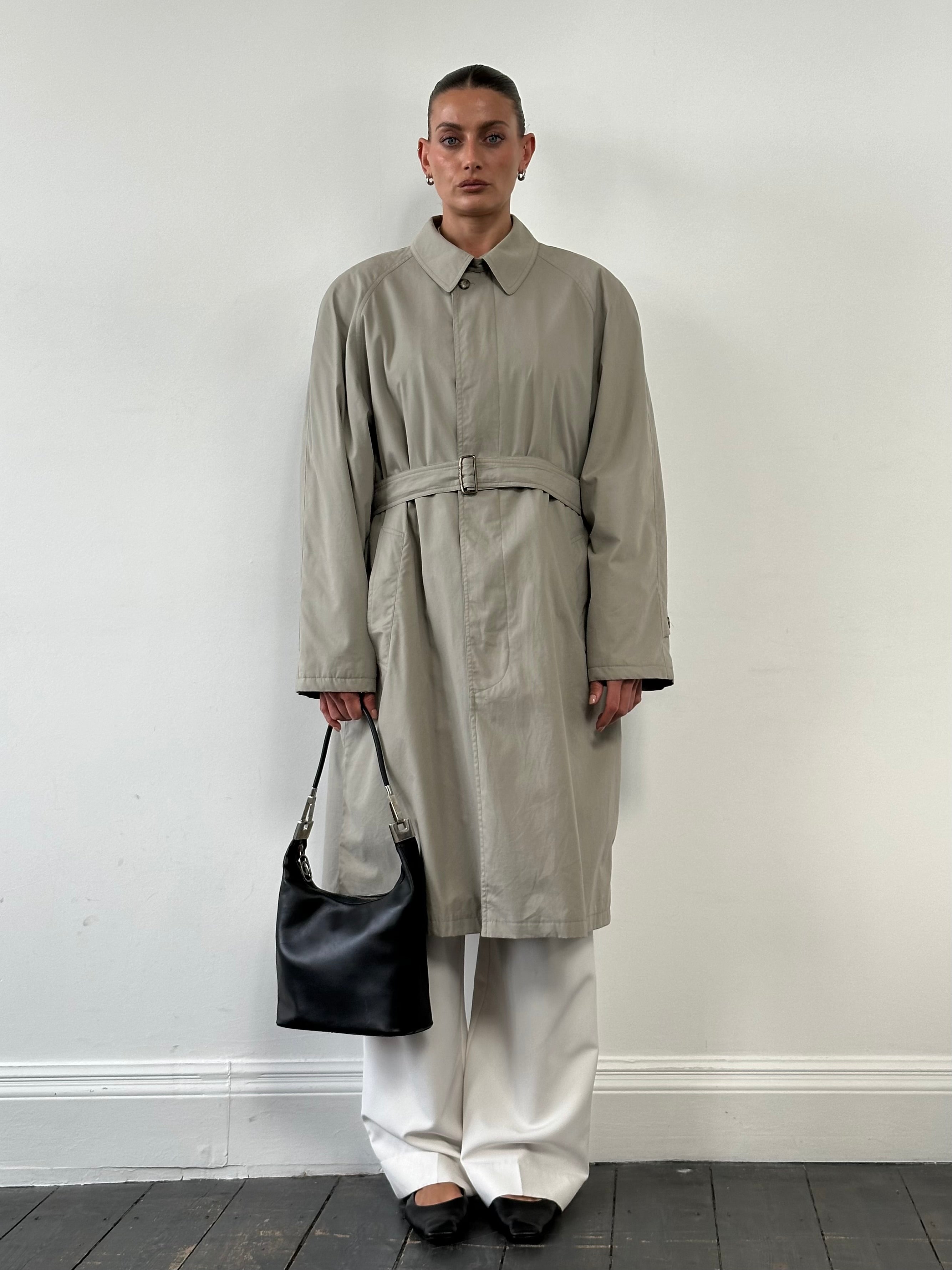 Vintage Italian trench coat with concealed placket, belted design, in XL size, featuring classic vintage style and neutral fabric.