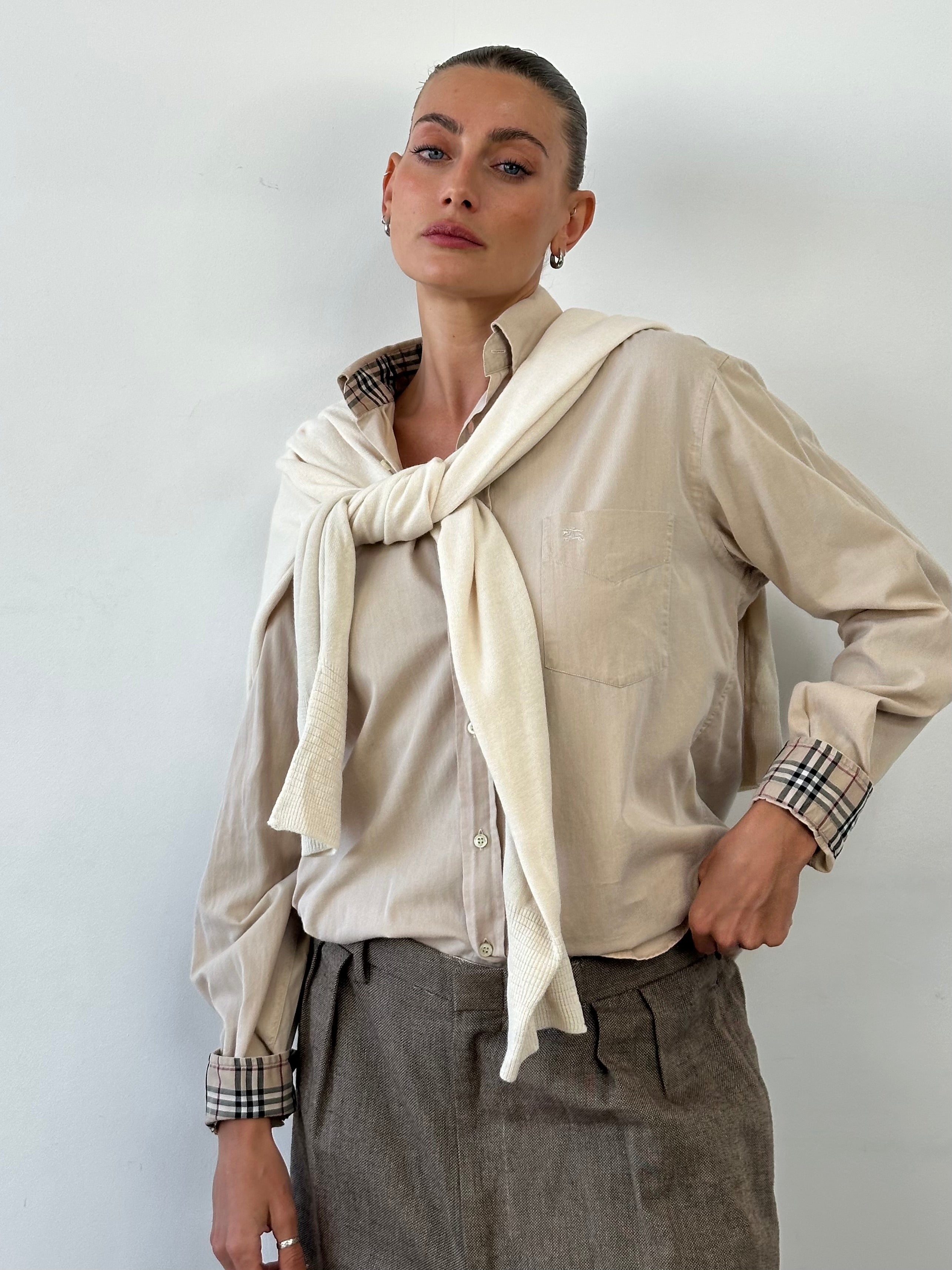 Burberry London pure cotton logo shirt in size M/L, featuring classic design and signature branding on the front.