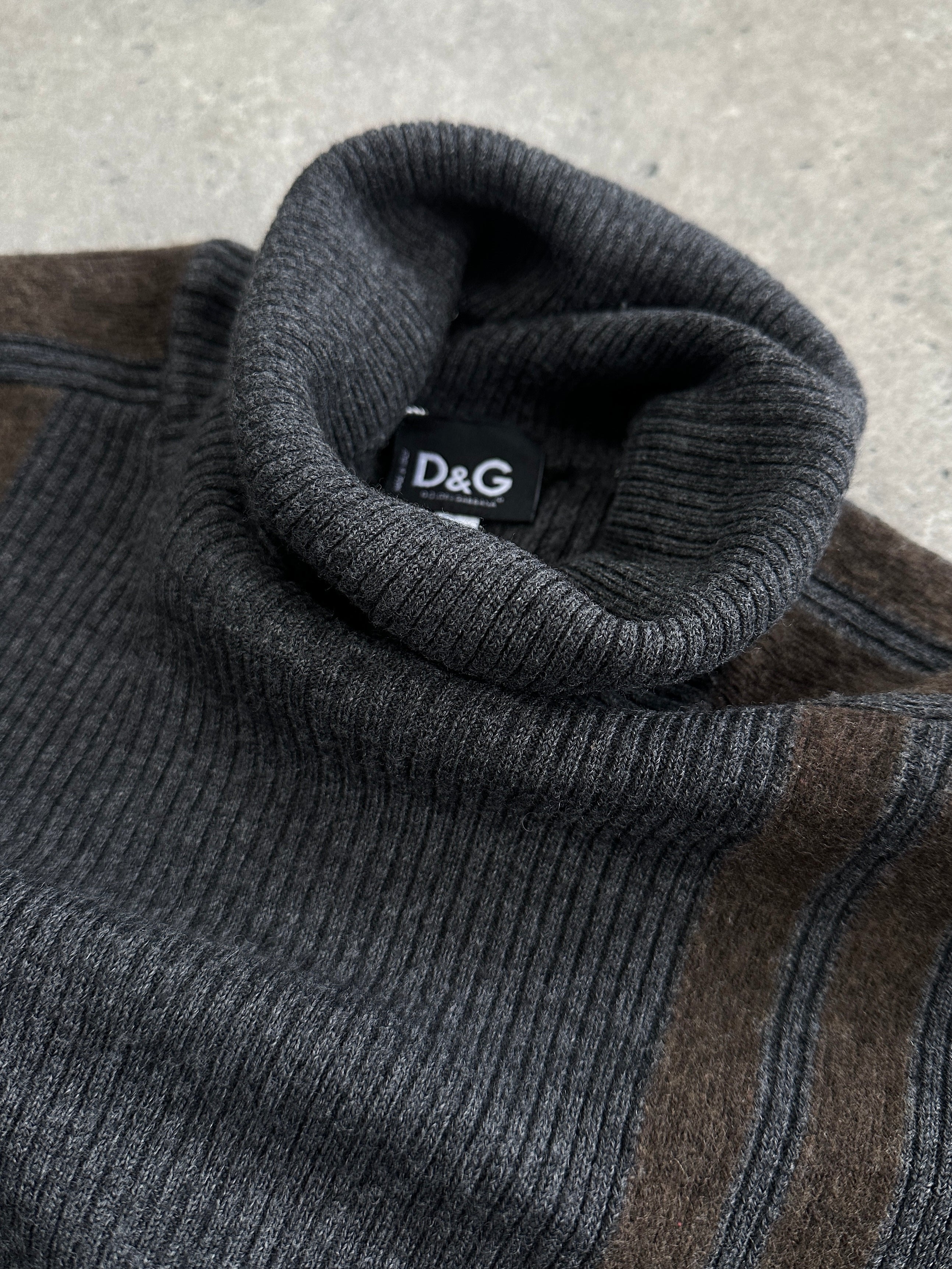 Dolce & Gabbana wool rib knit turtleneck jumper in black, showing close-up of the textured fabric and classic fit.