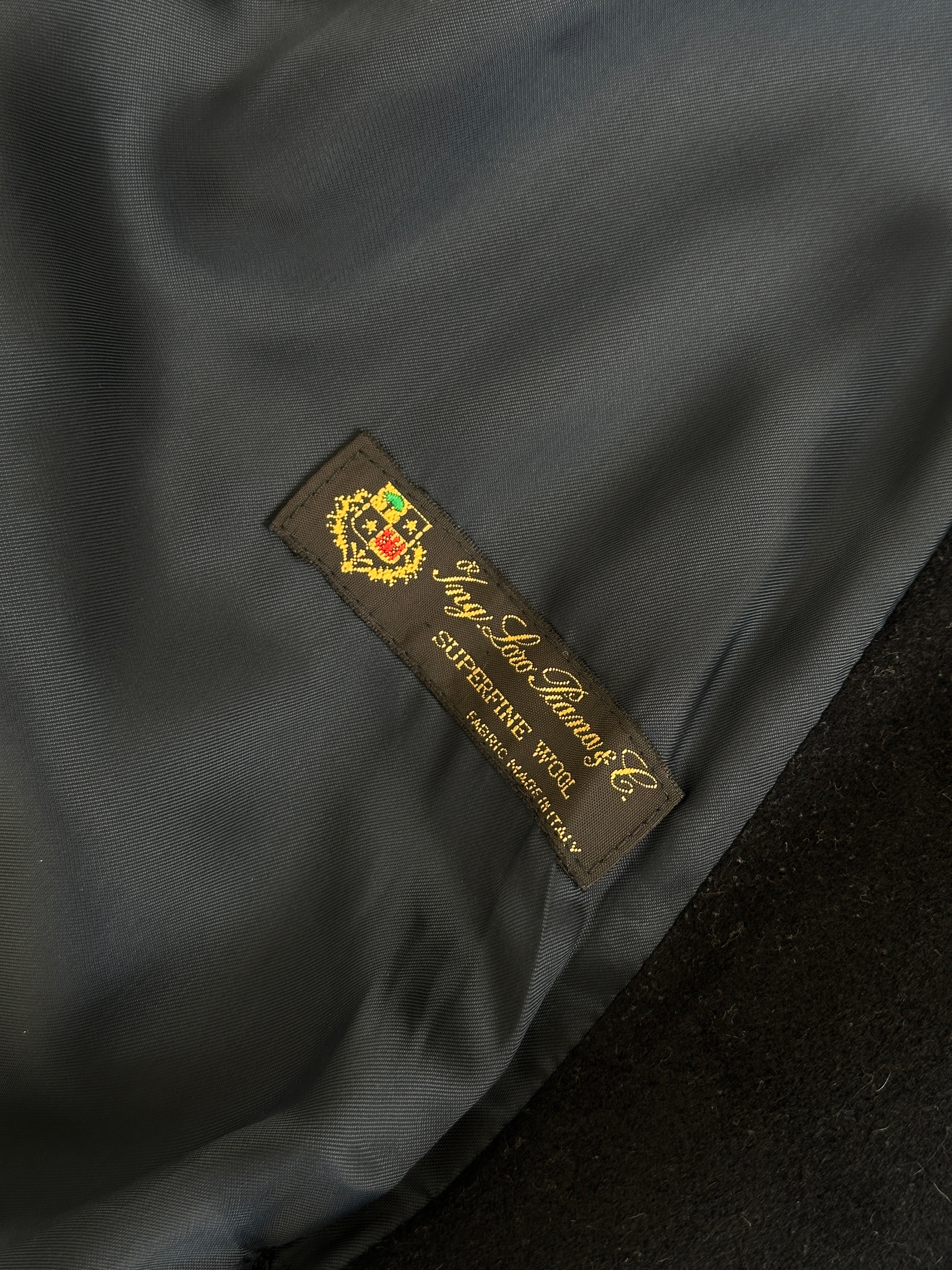 Loro Piana pure wool double-breasted coat in size L/XL, featuring a classic design and tailored fit, displayed on a neutral background.