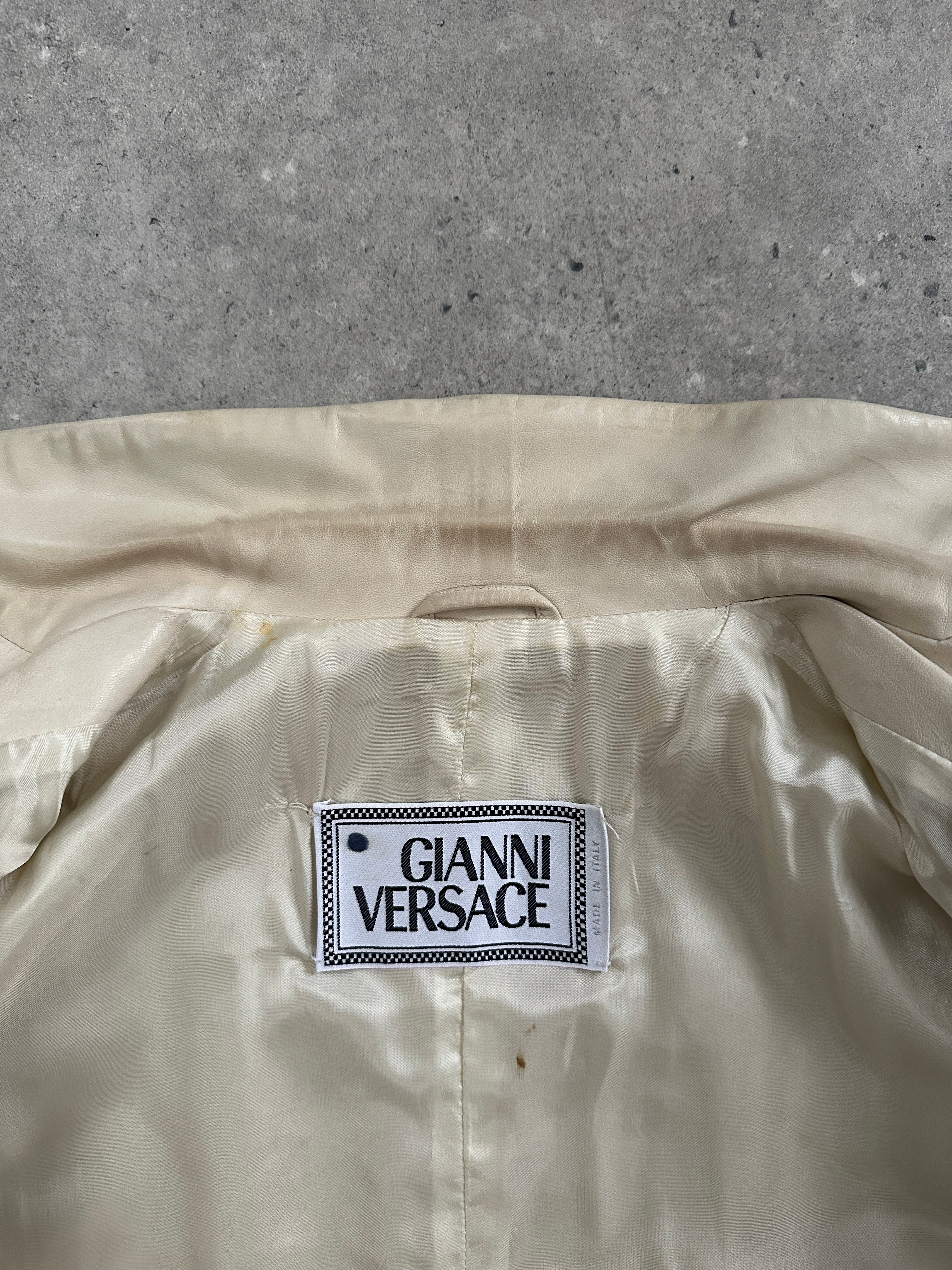 Versace 1990s leather jacket in size small, stylish black leather with classic design and detailed stitching.