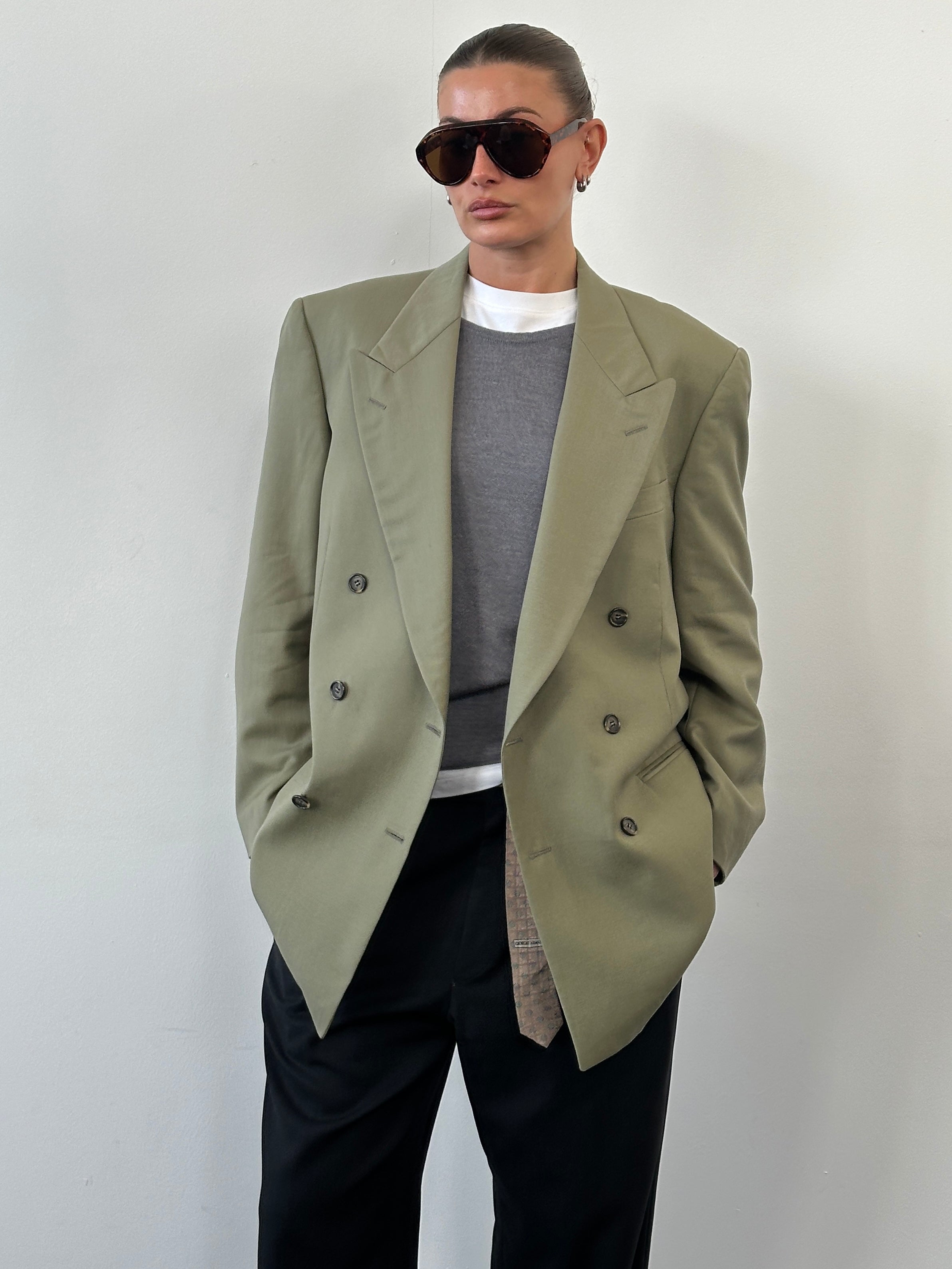 Yves Saint Laurent 1980s pure wool double-breasted blazer in size 40R/L, featuring classic tailored design and structured fit.