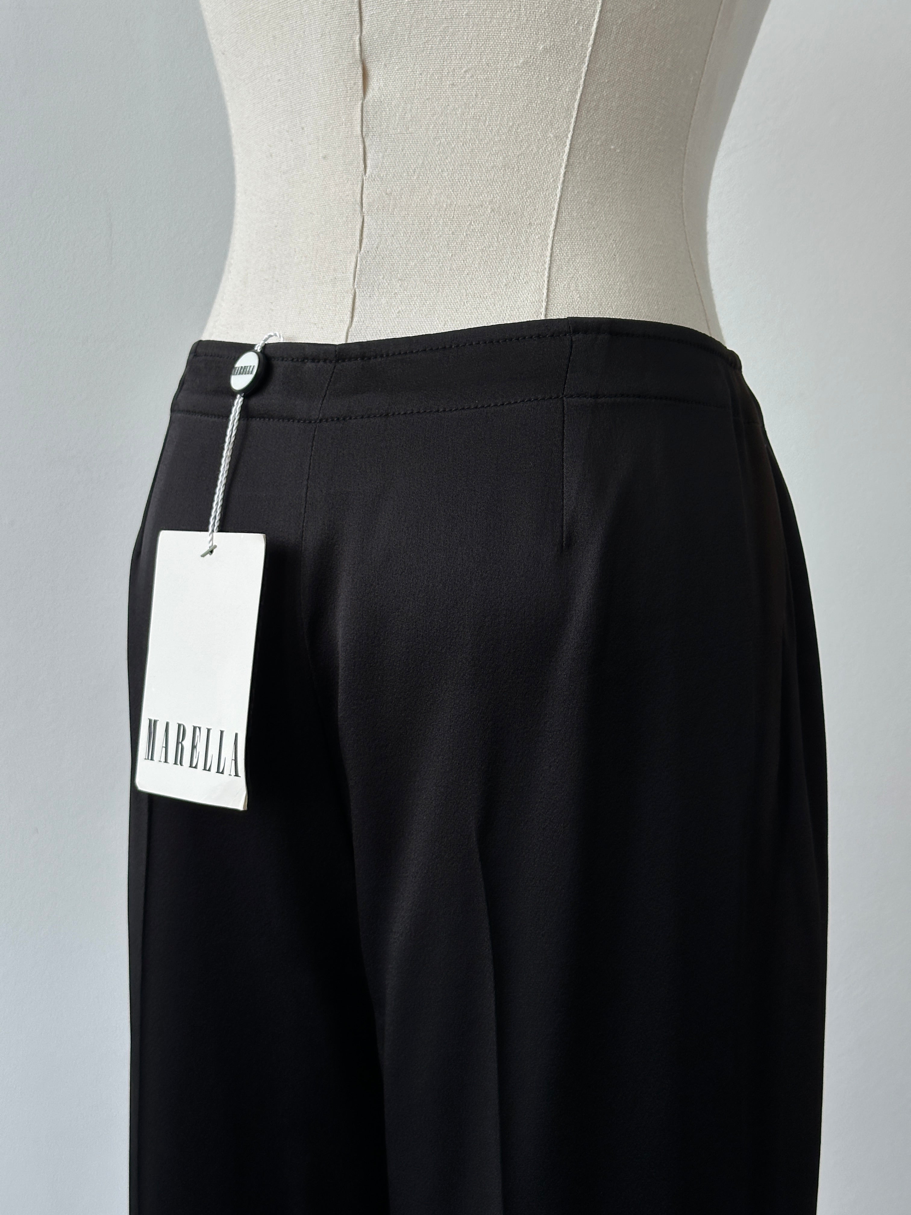 Marella 2000s loose straight leg trousers in size W30, showing beige fabric with relaxed fit and waistband detail.