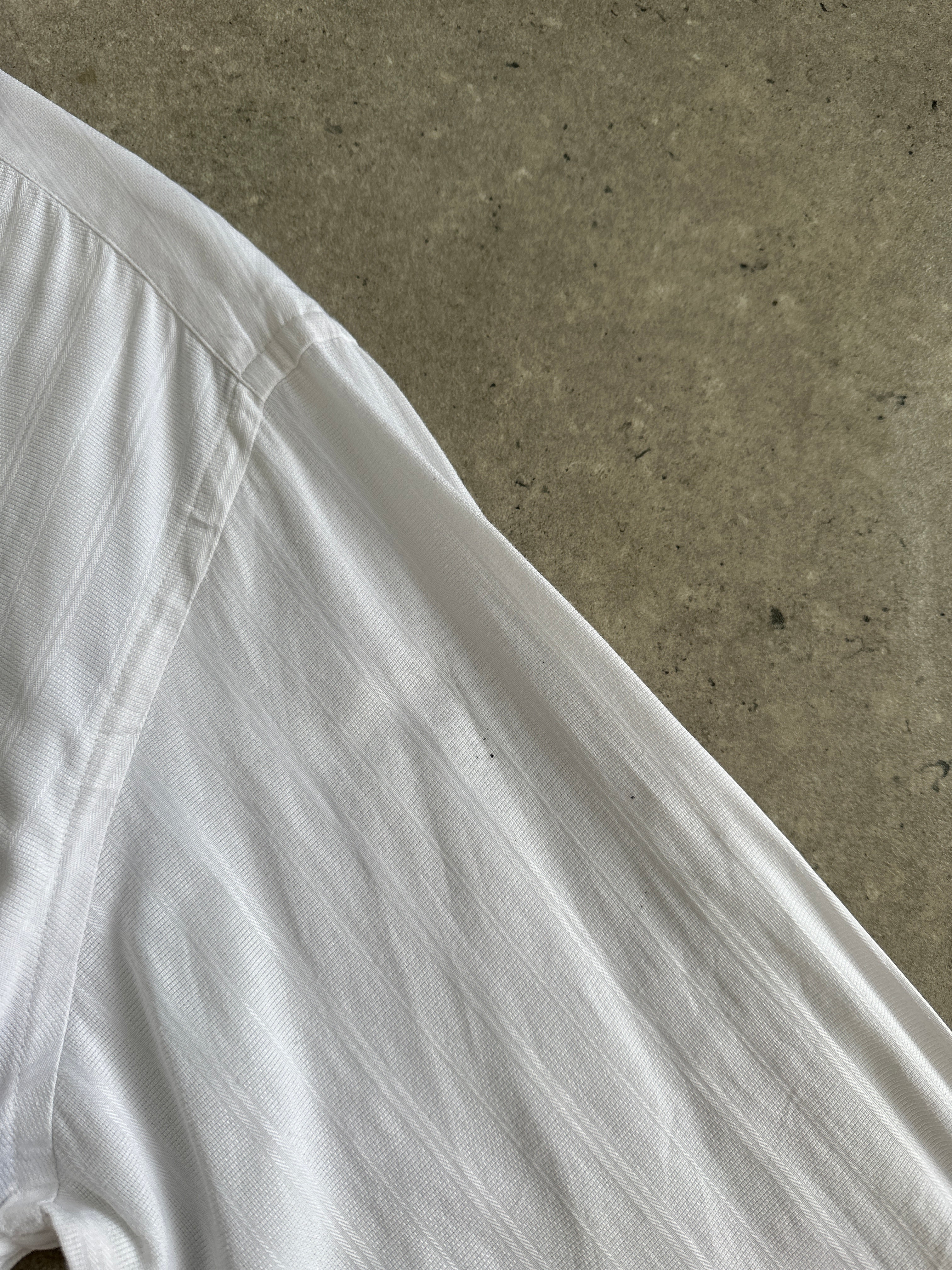 Yves Saint Laurent Pour Homme 1990s cotton logo shirt in size M, featuring the classic YSL branding on the front.