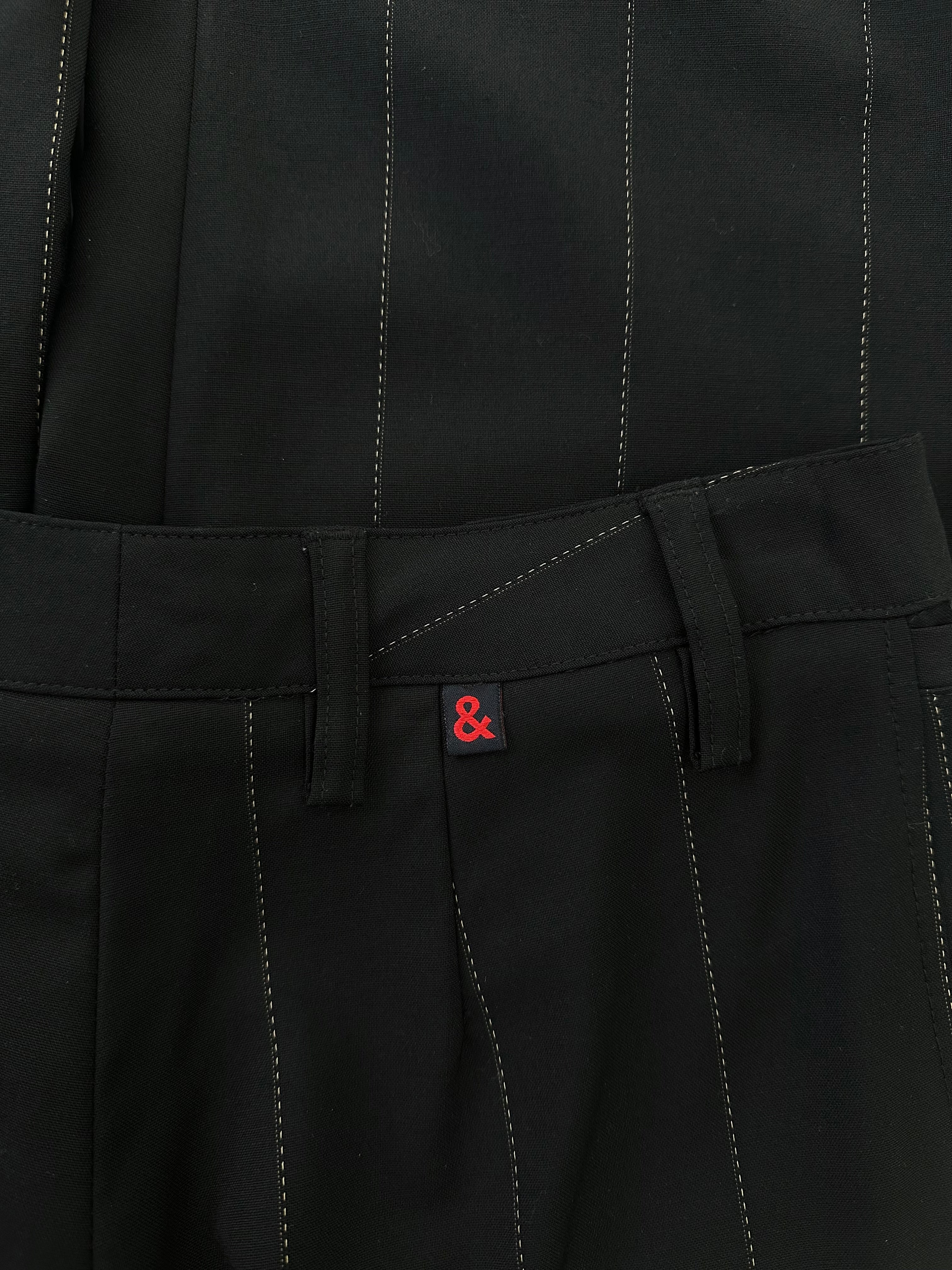 Dolce & Gabbana 2000s wool trousers in size W28, tailored fit, dark color, with classic waistband and front pockets.