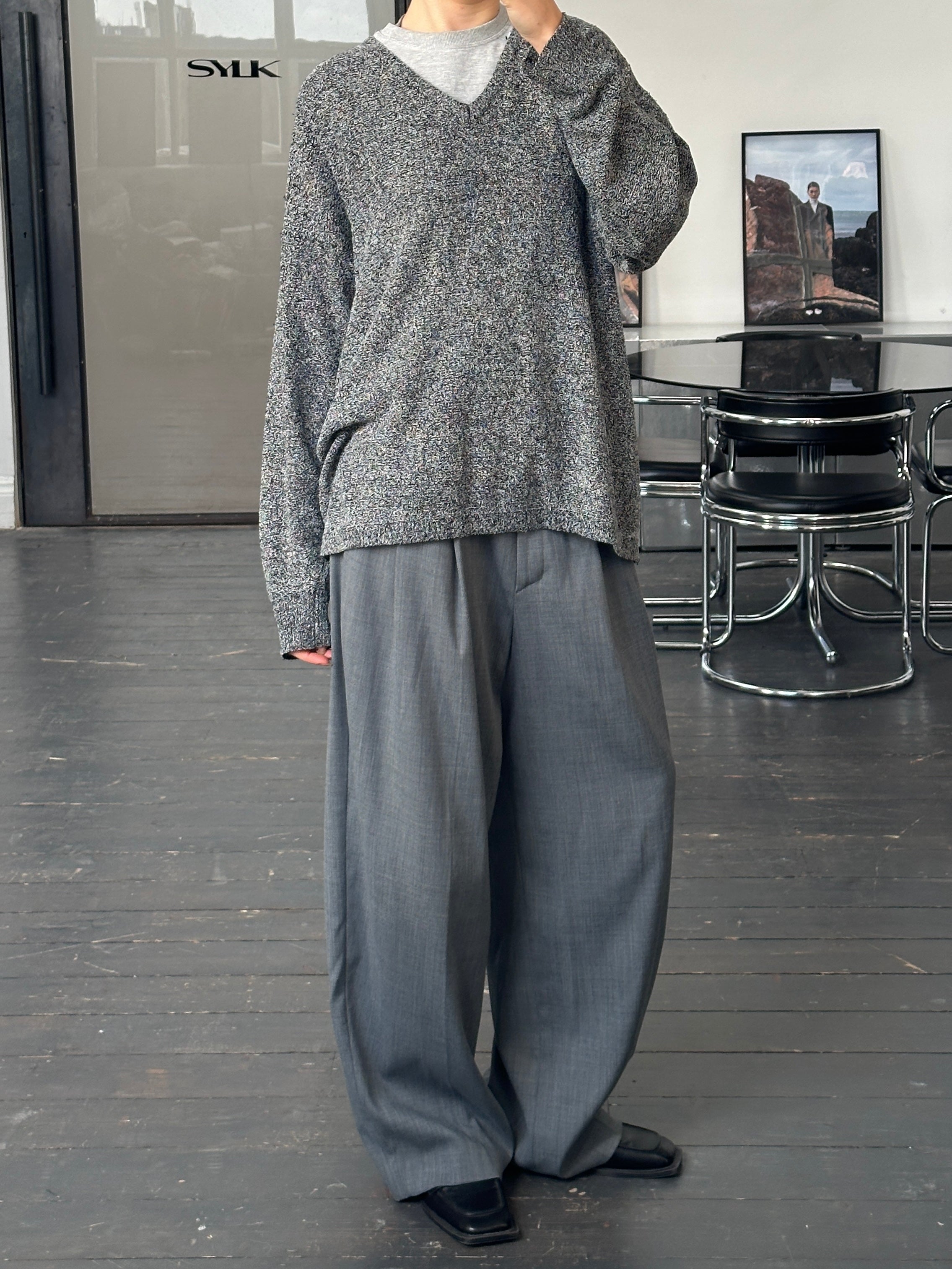 Versace Jeans Couture 1990s wool V-neck jumper in XL, featuring a classic design and soft texture, displayed on a plain background.