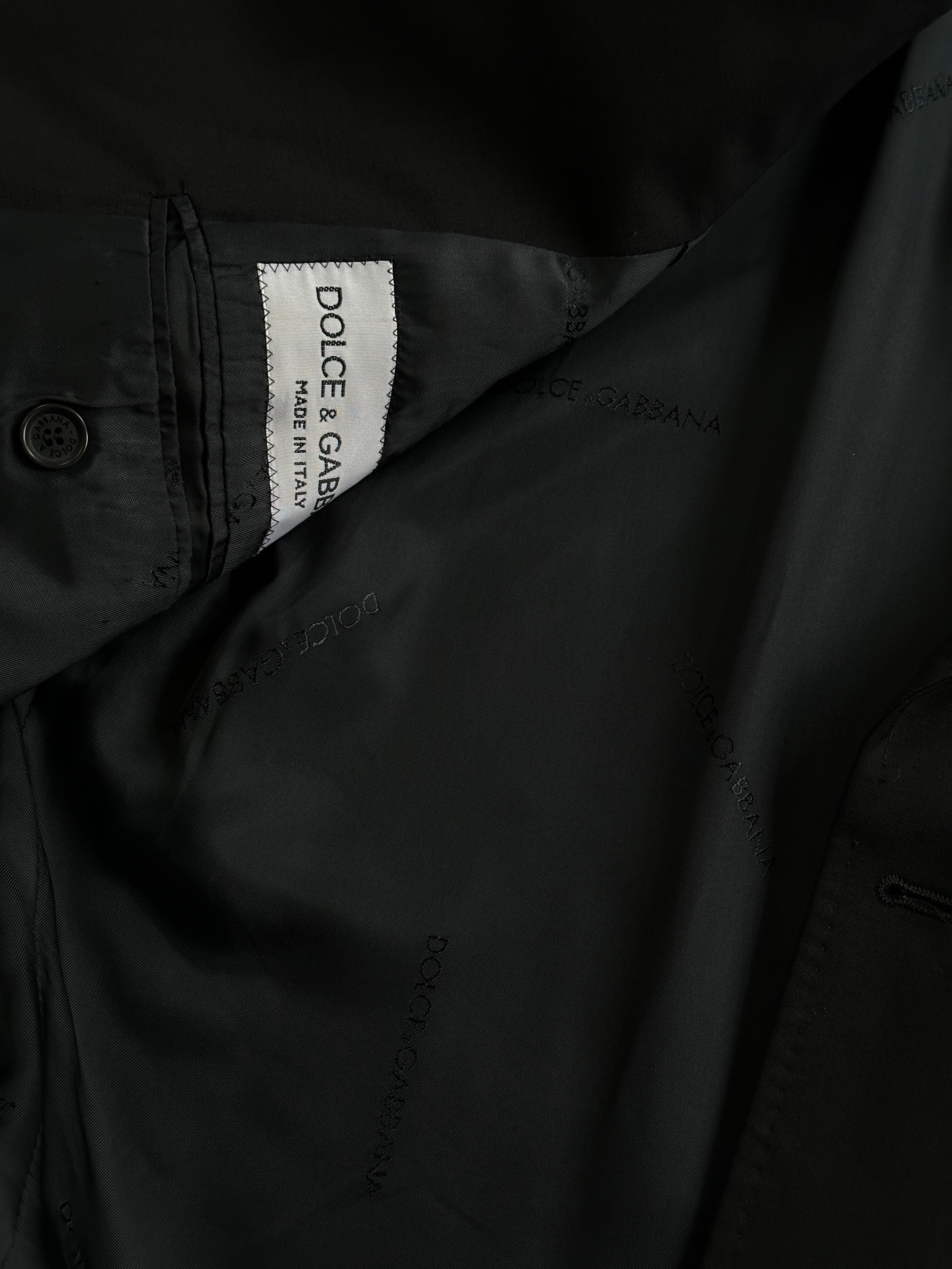 Dolce & Gabbana single-breasted virgin wool blazer in size M, tailored fit with classic lapel and button closure.