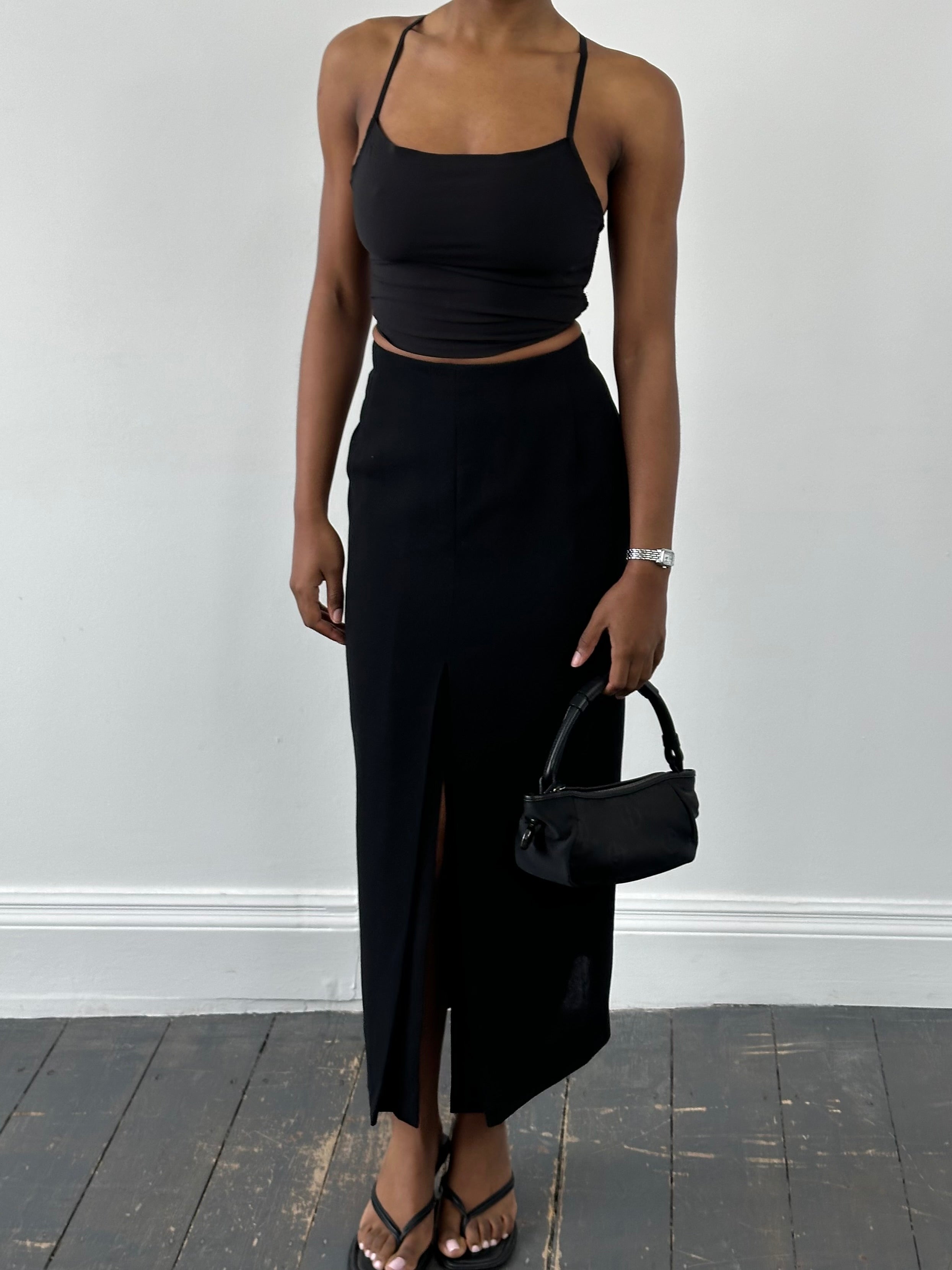 Jaeger 1990s pure wool side-split maxi skirt in neutral tones, featuring a high waist and flowing design.