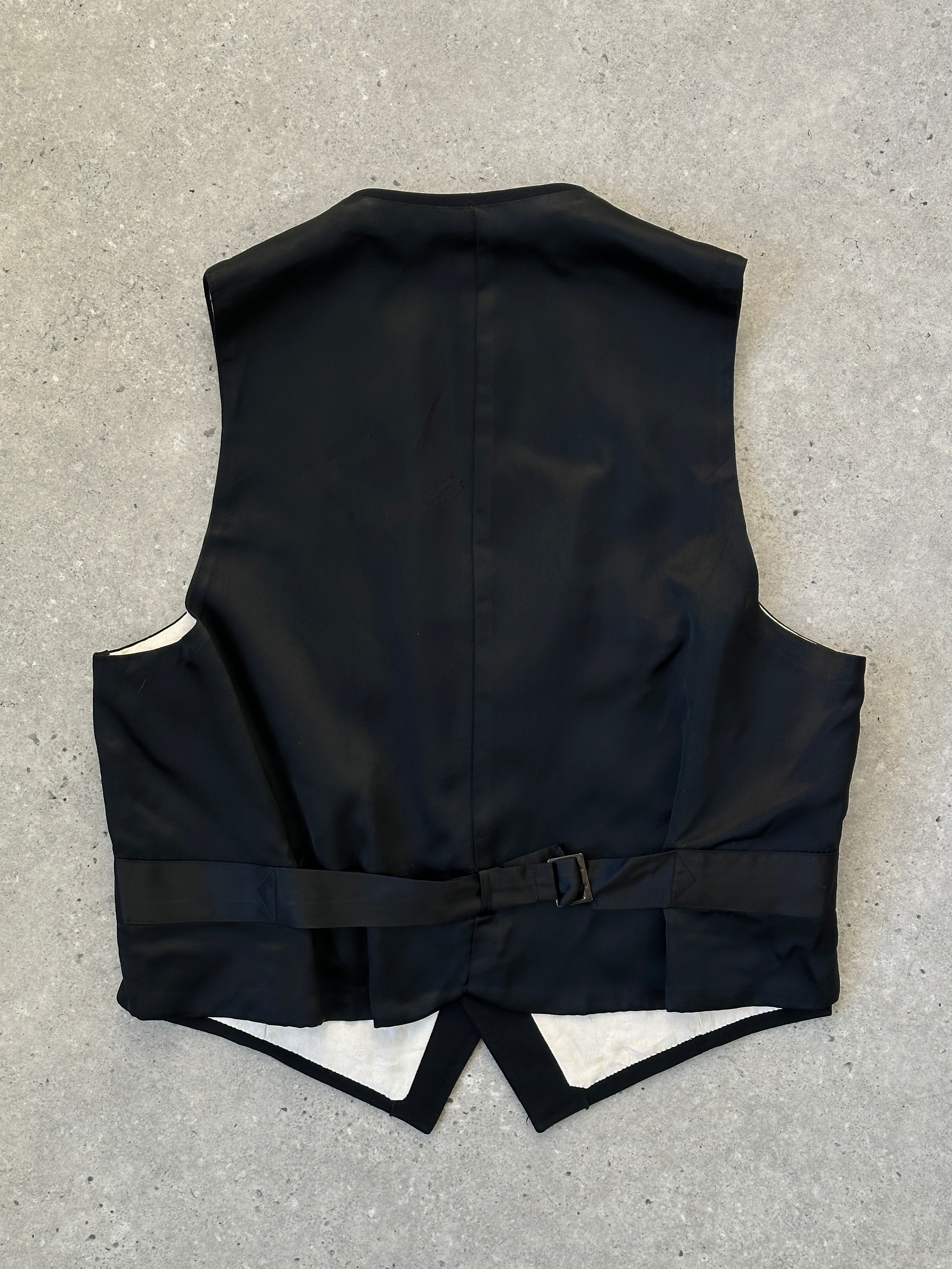 Vintage wool tuxedo waistcoat in size M, tailored coat with classic black fabric and button details.