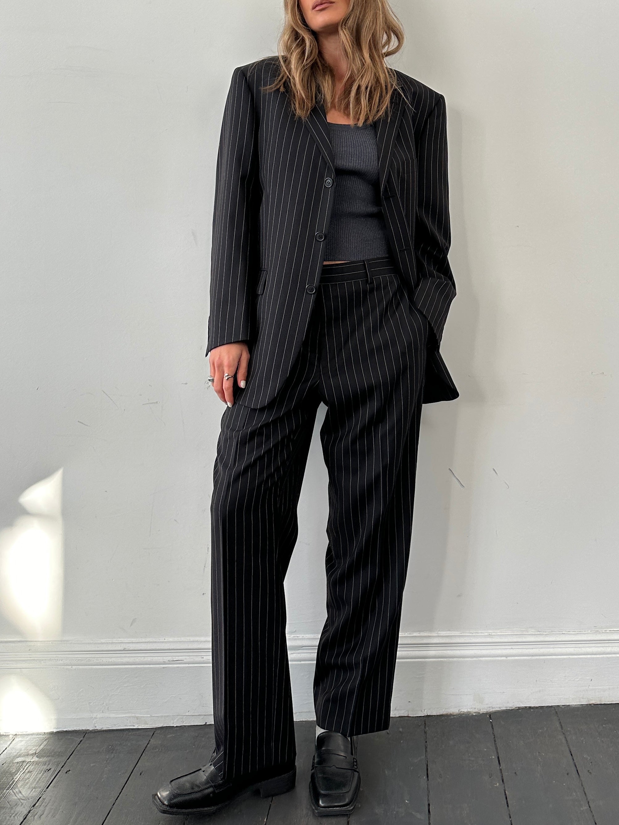 Yves Saint Laurent pinstripe wool jumpsuit in size 40S/W34, featuring tailored fit and classic pinstripe pattern.