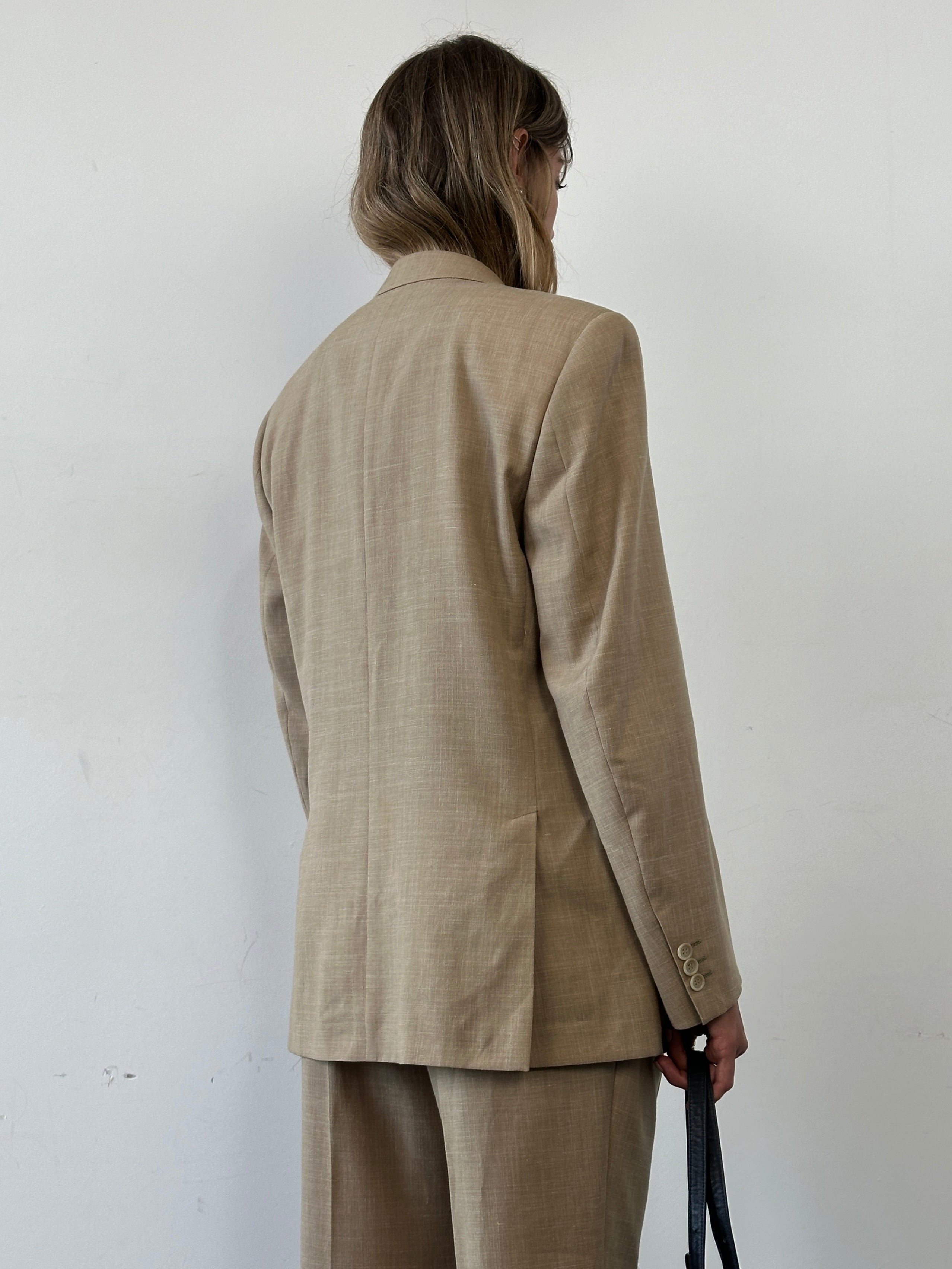 Vintage single-breasted wool linen blend suit jumpsuit in size 36R/W31, shown in classic style with tailored fit and neutral tones.