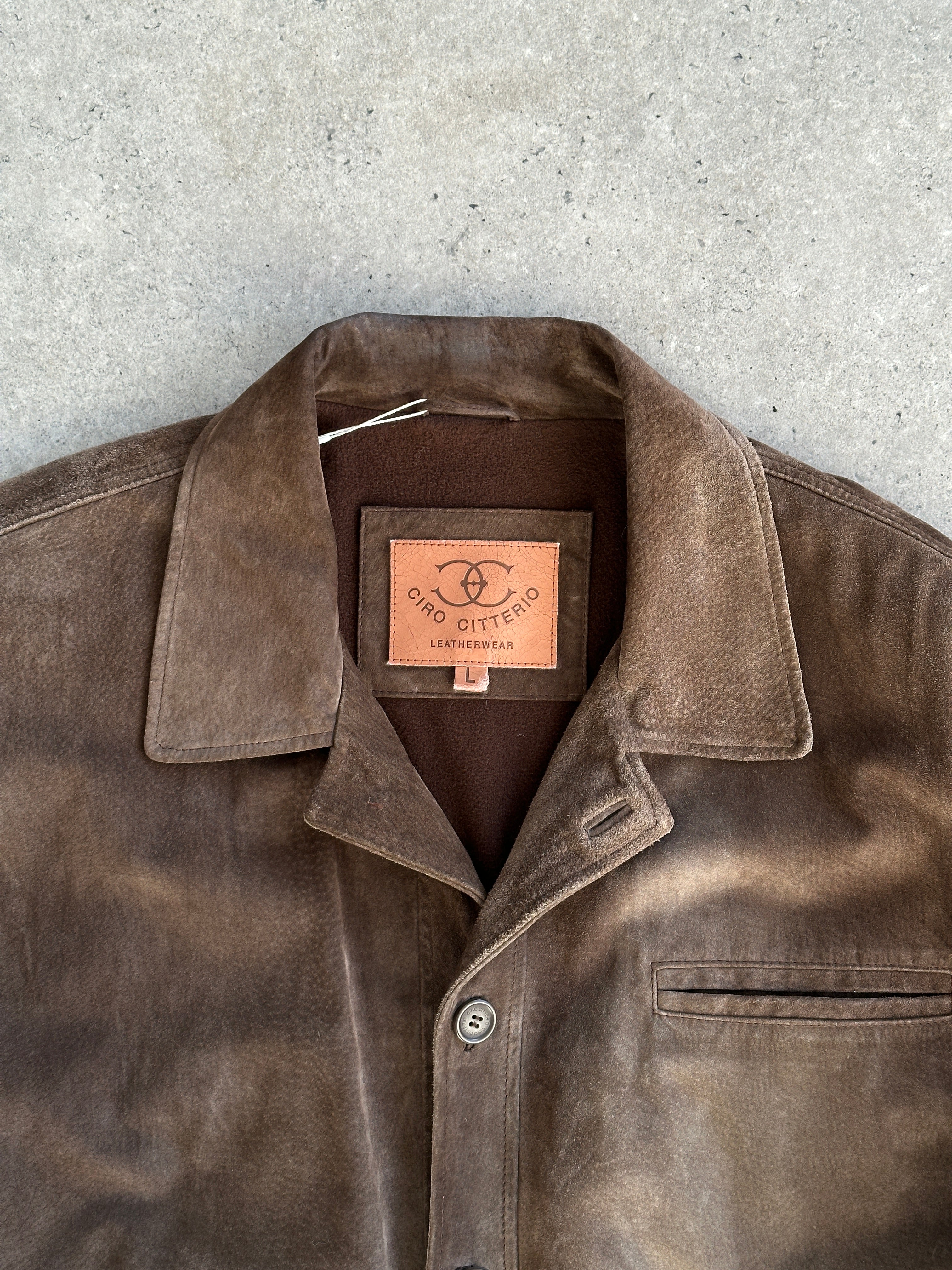 Vintage suede leather jacket in XL/XXL size, featuring classic design and rich texture, displayed on a hanger.