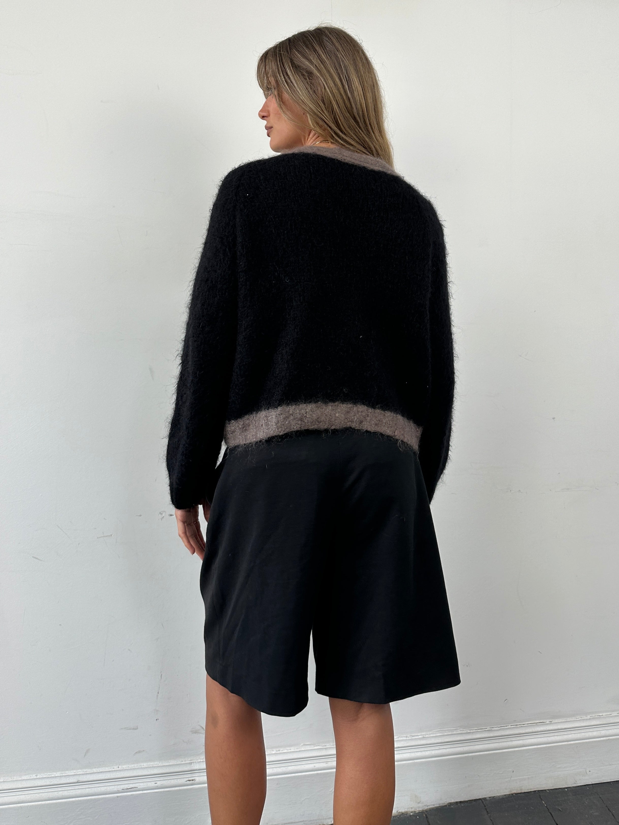 Vintage brand fuzzy mohair wool cardigan in size large, featuring a cozy, textured knit with a relaxed fit and classic design.
