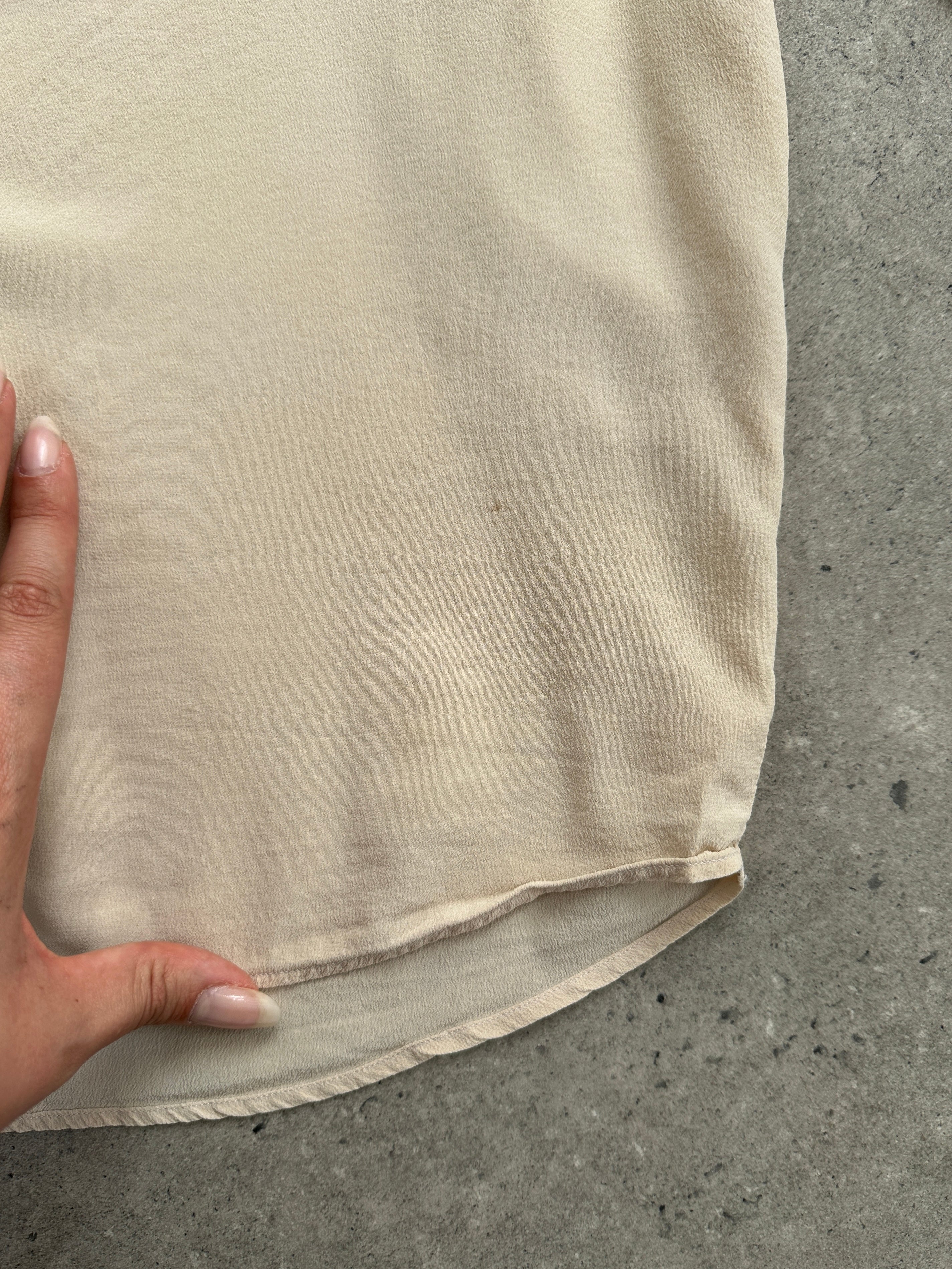 Vintage Italian vintage pure silk blouse with concealed placket, short sleeves, and elegant design, size small.