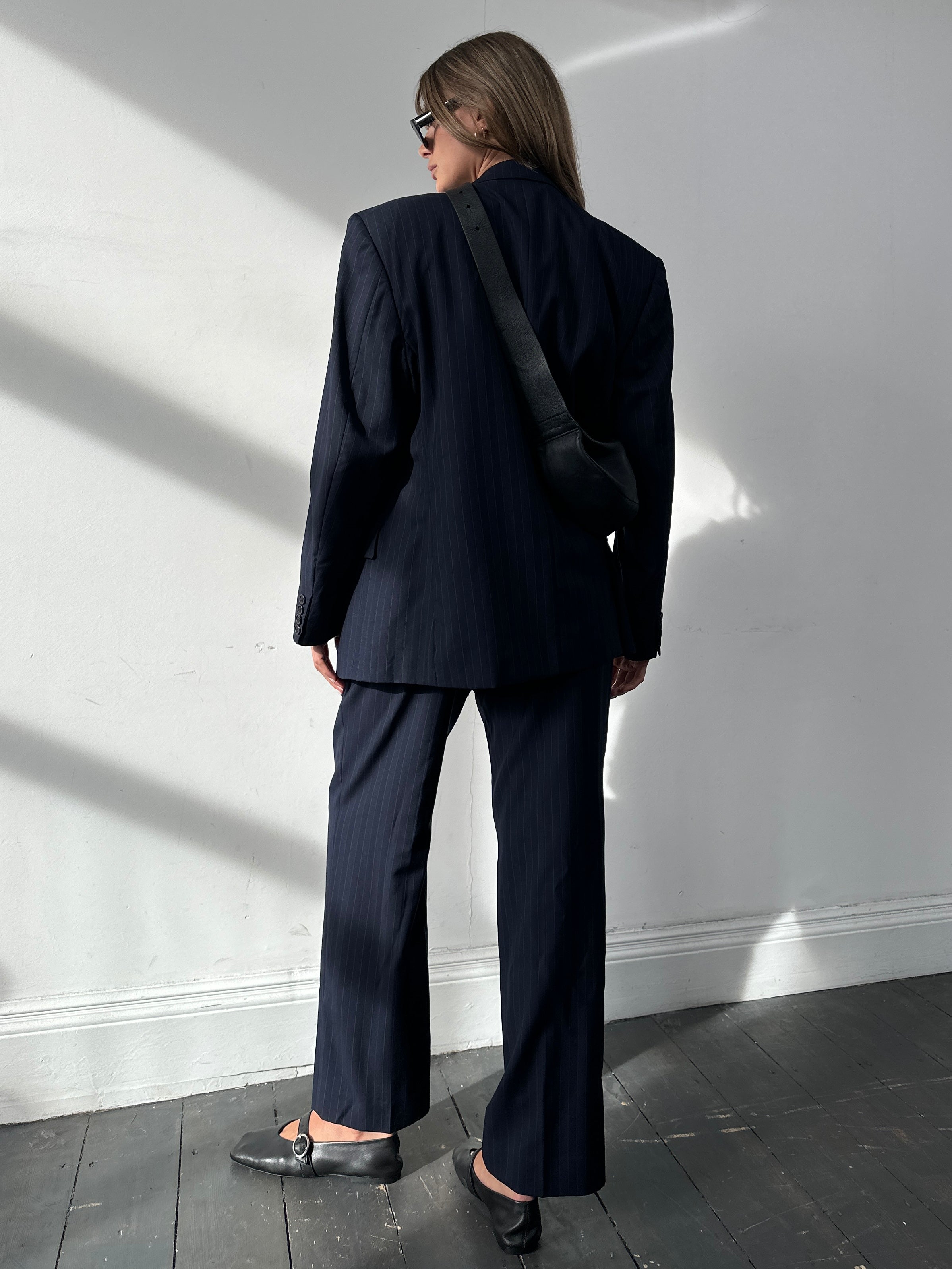 Christian Dior Monsieur pinstripe wool double-breasted suit in size 44S/W34, tailored with a classic fit and sharp lapels.