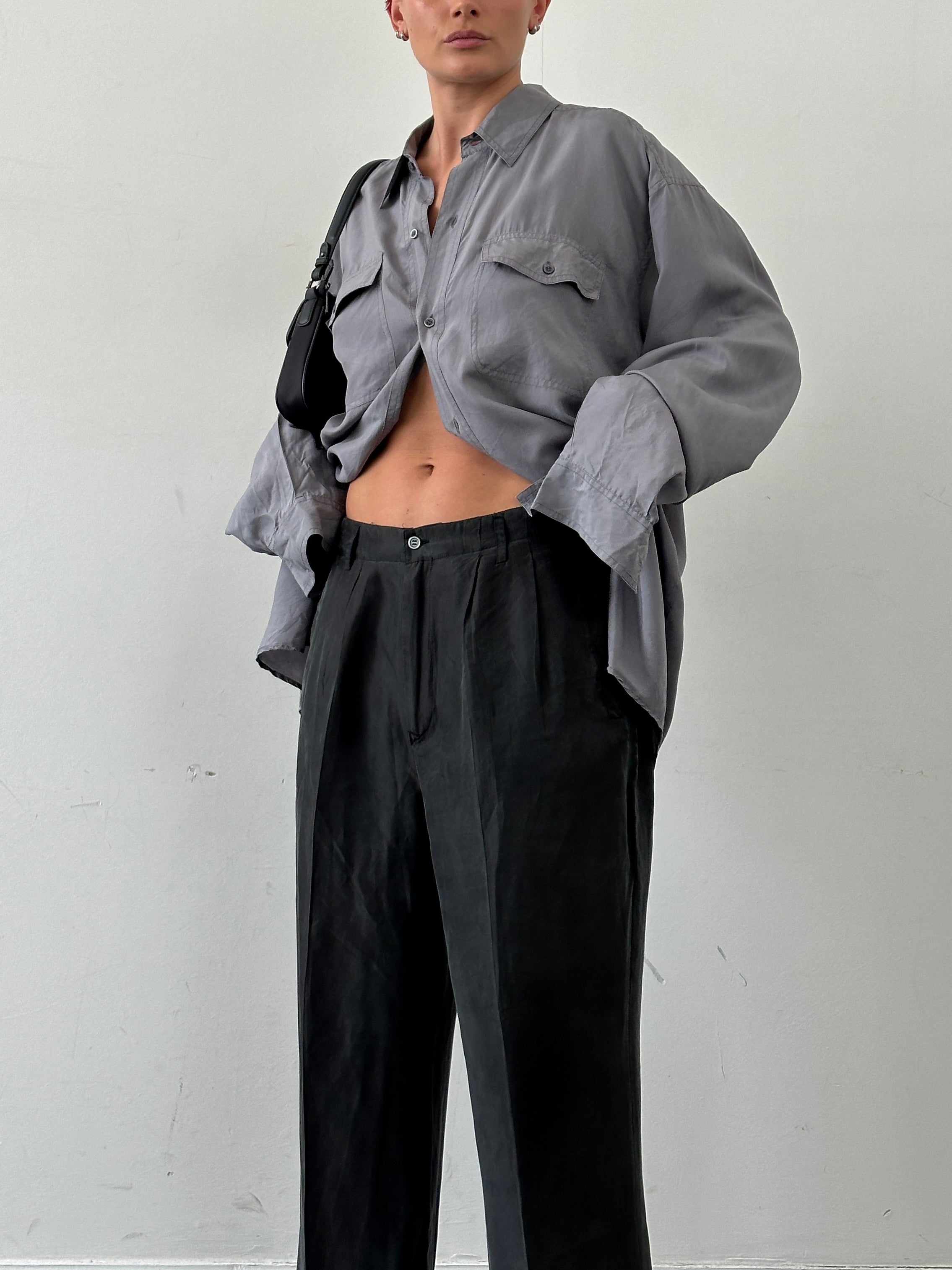 Vintage pure silk high-waisted straight leg trousers in W32, shown on a hanger with a smooth, elegant fabric and classic style.