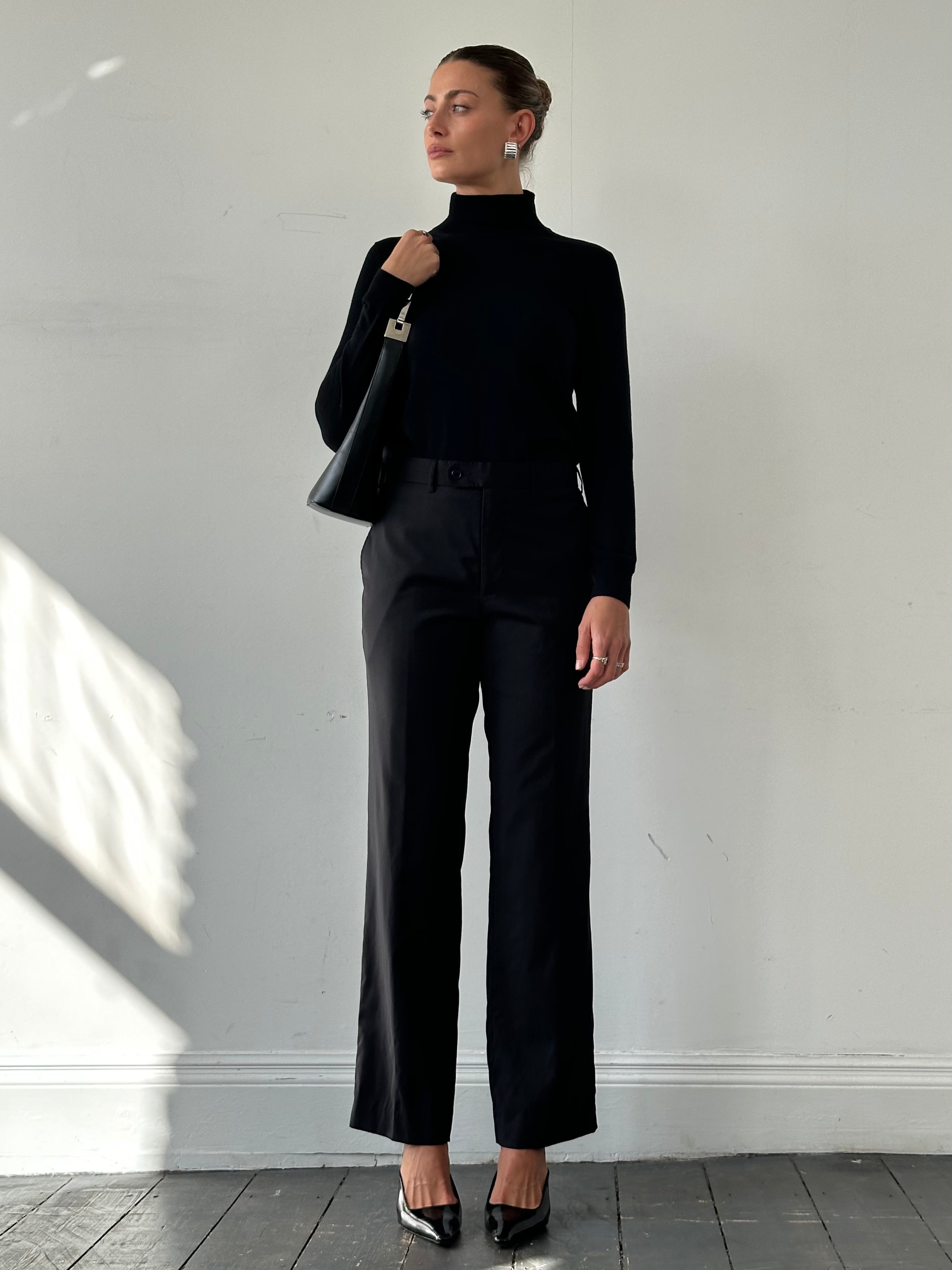 Vintage wool high-waisted straight-leg tailored trousers in natural fabric, showcasing the classic fit and vintage style.
